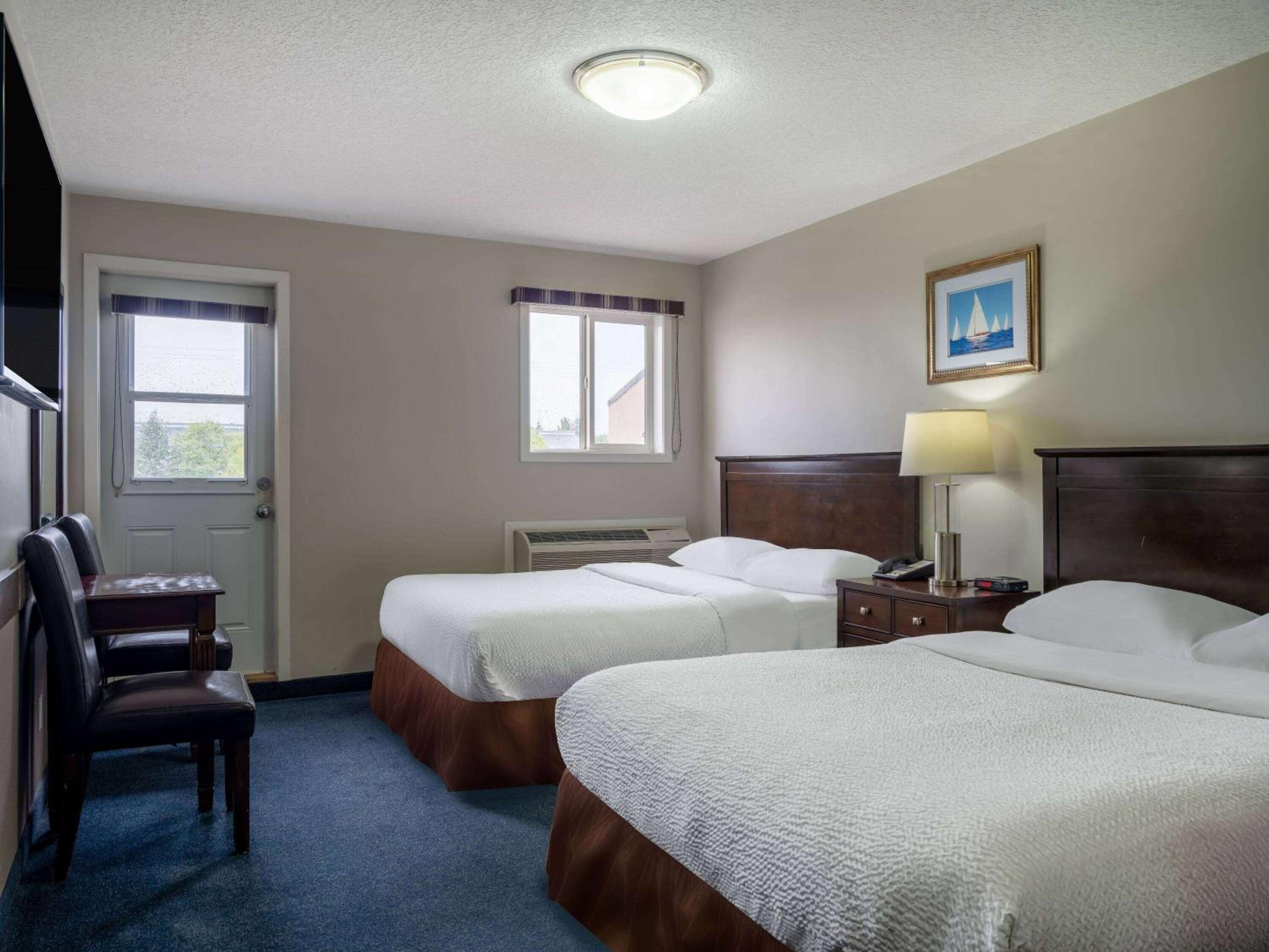 Queen Room with Two Queen Beds - Non-Smoking - Photo 1