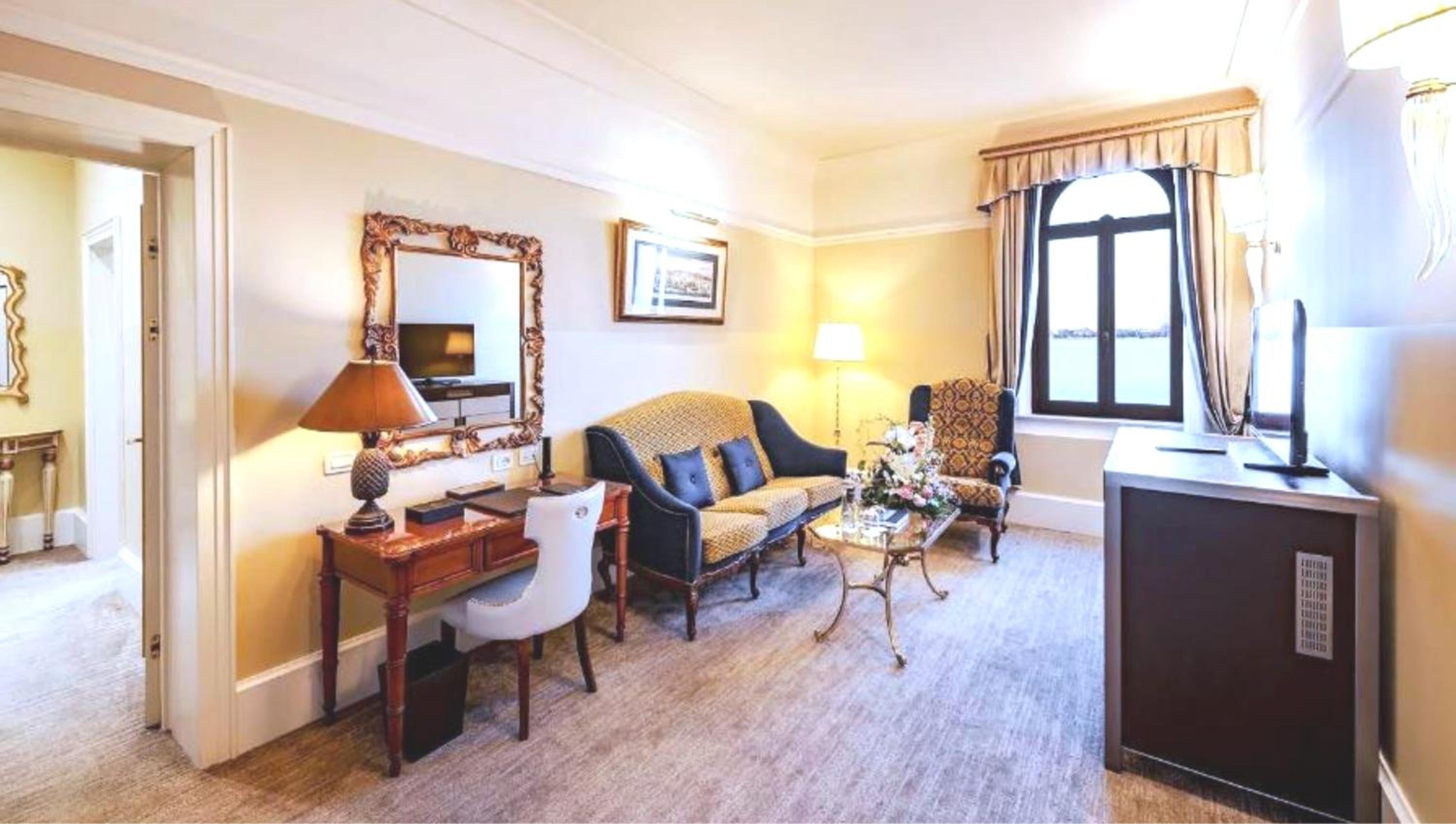 living room with couches, chairs, and a table