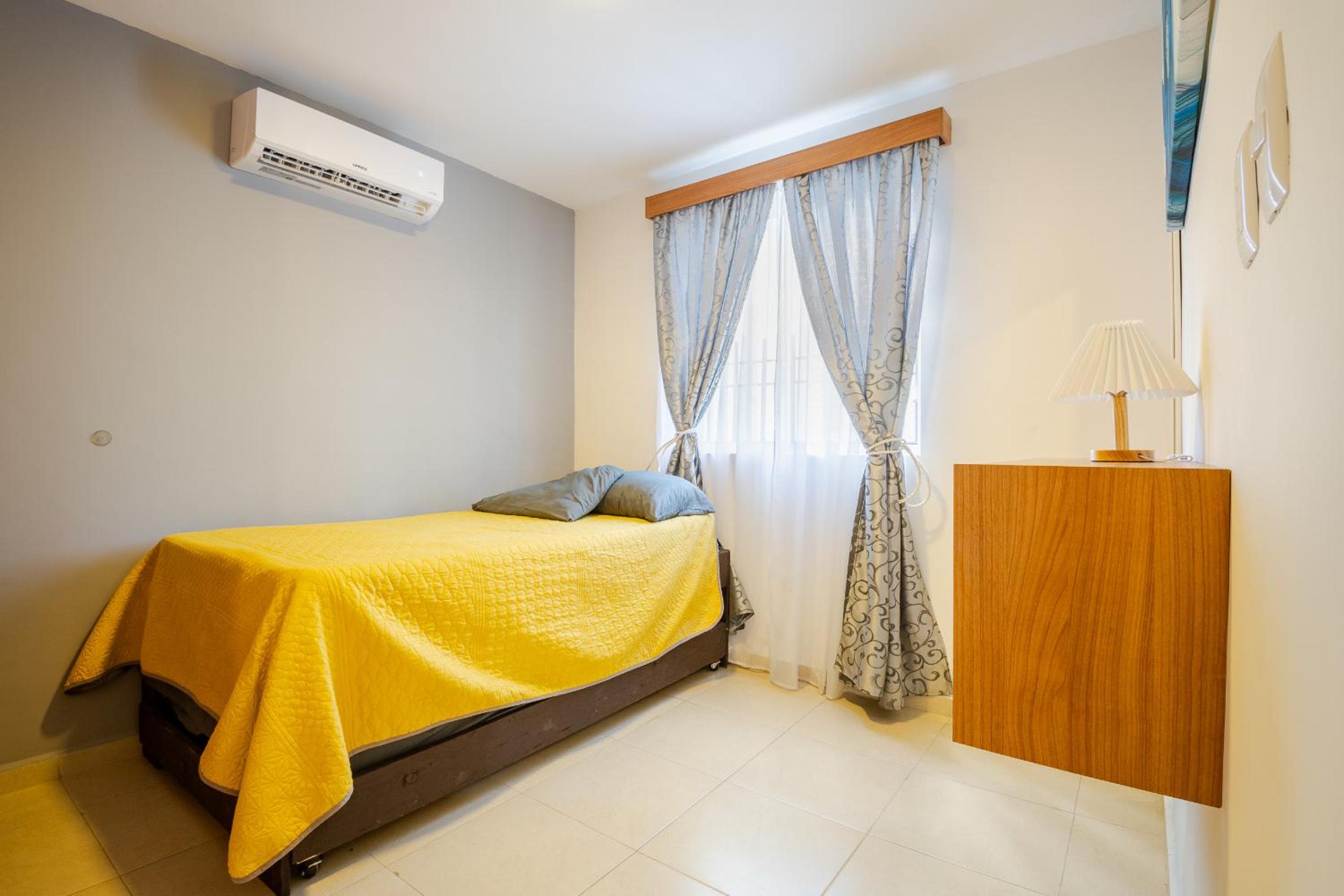 Three-Bedroom House - Photo 19