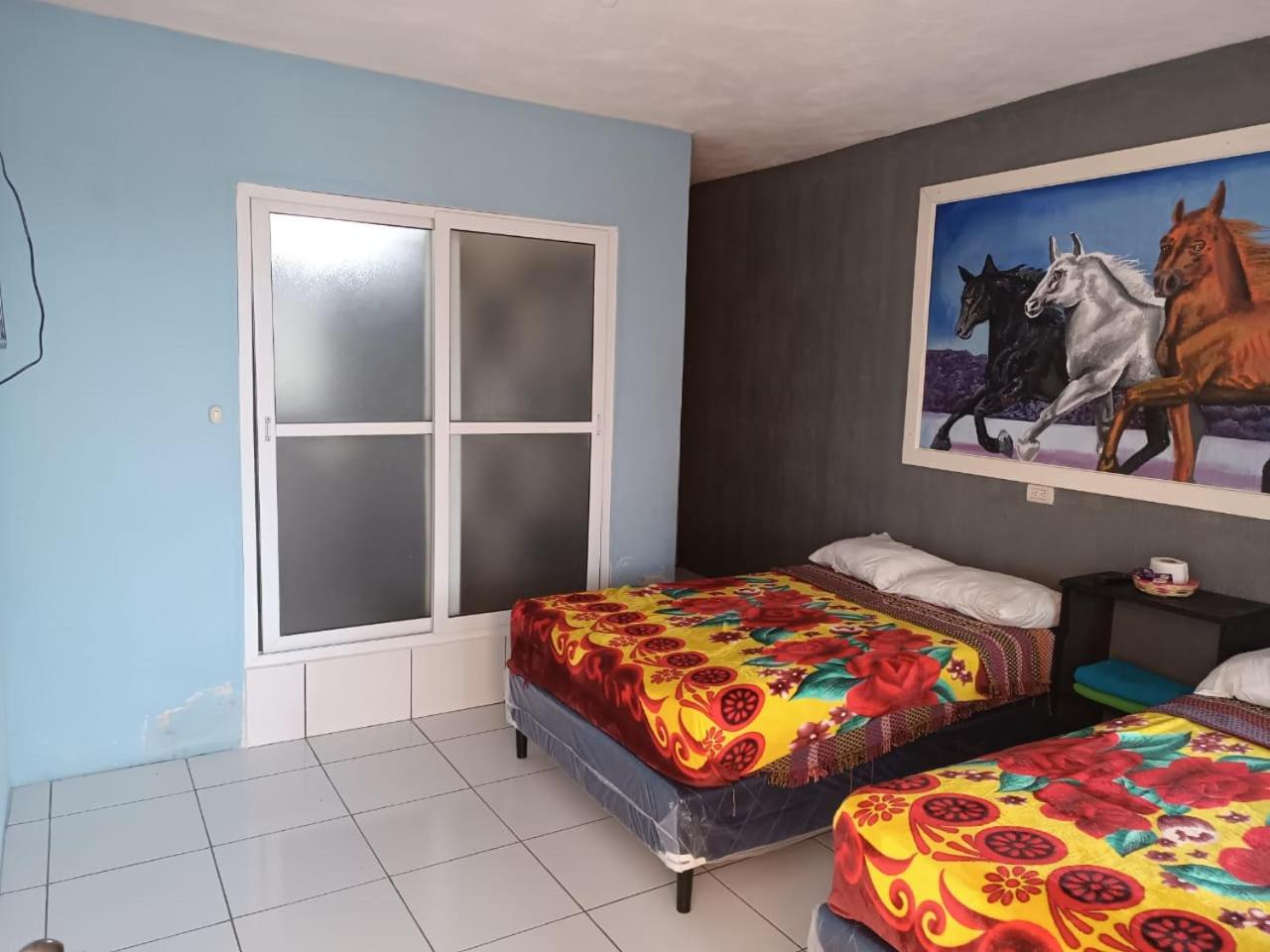 Deluxe Queen Room With Two Queen Beds photo 1