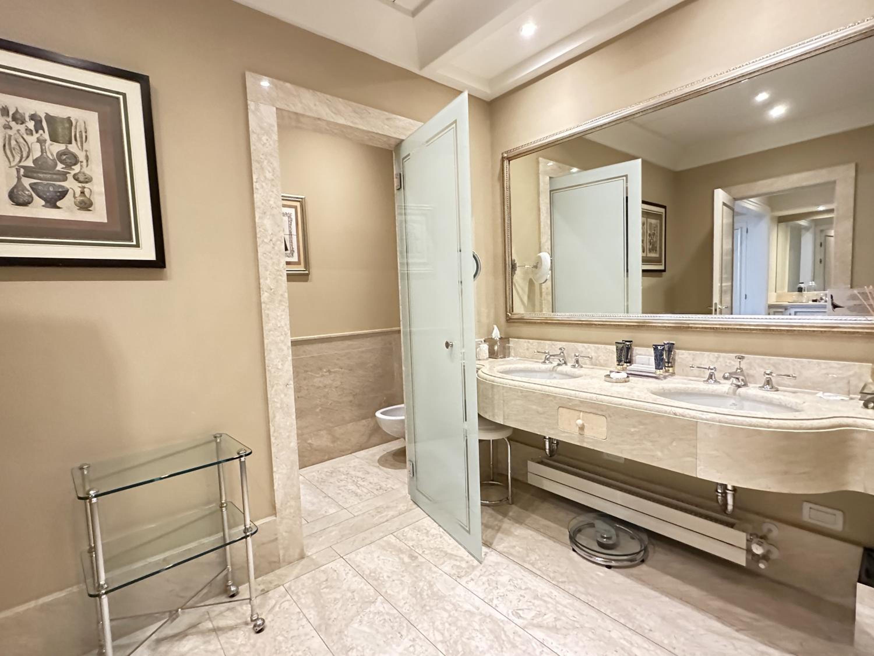 bathroom with two sinks and a large mirror on the wall