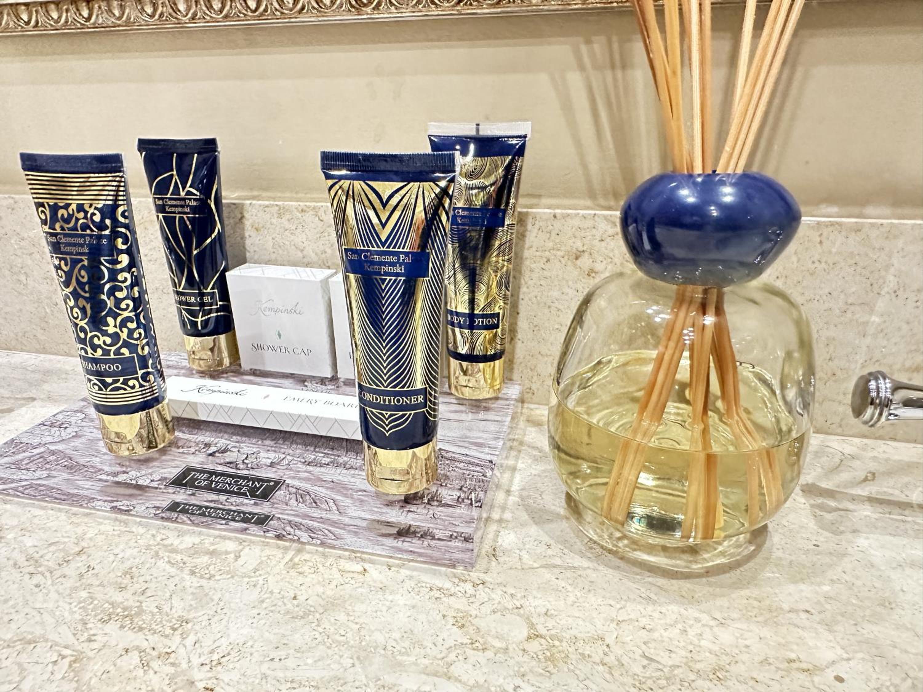 bathroom counter with a lot of beauty products on it