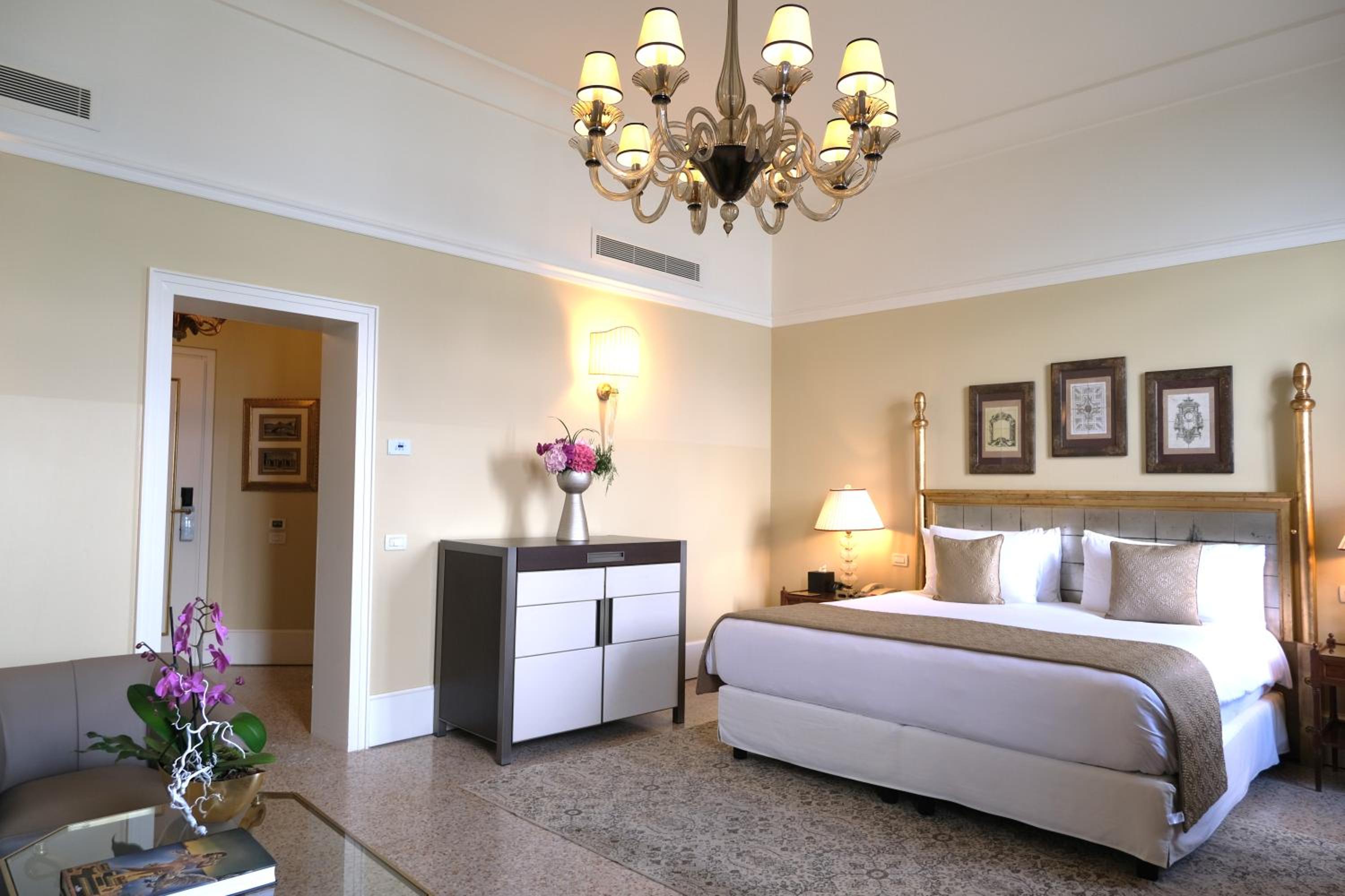 bedroom with a large bed and a chandelier