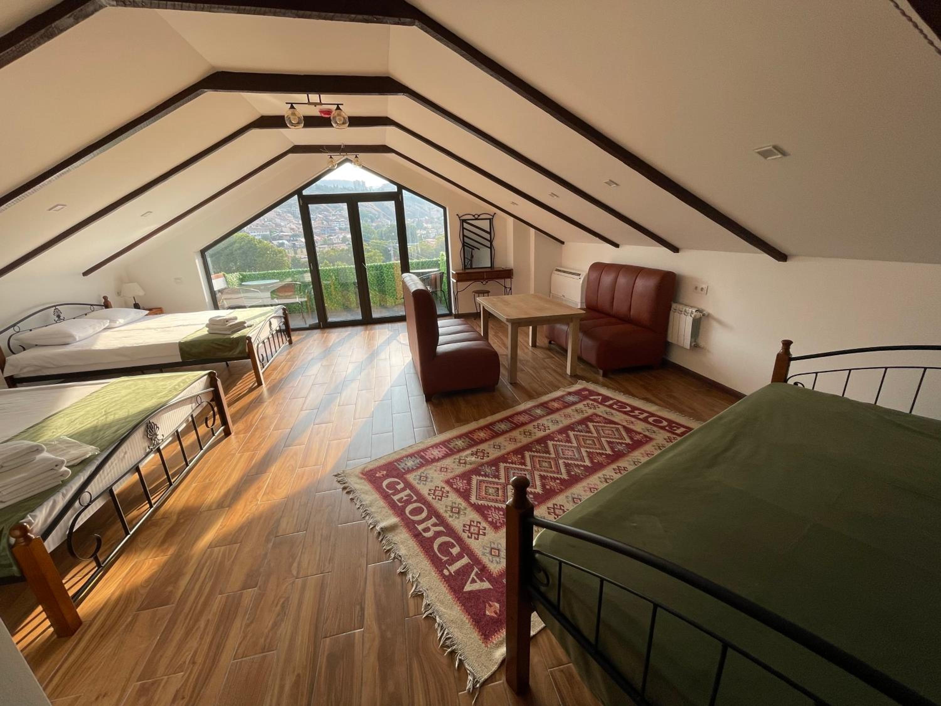 Family Room with Balcony - Photo 1