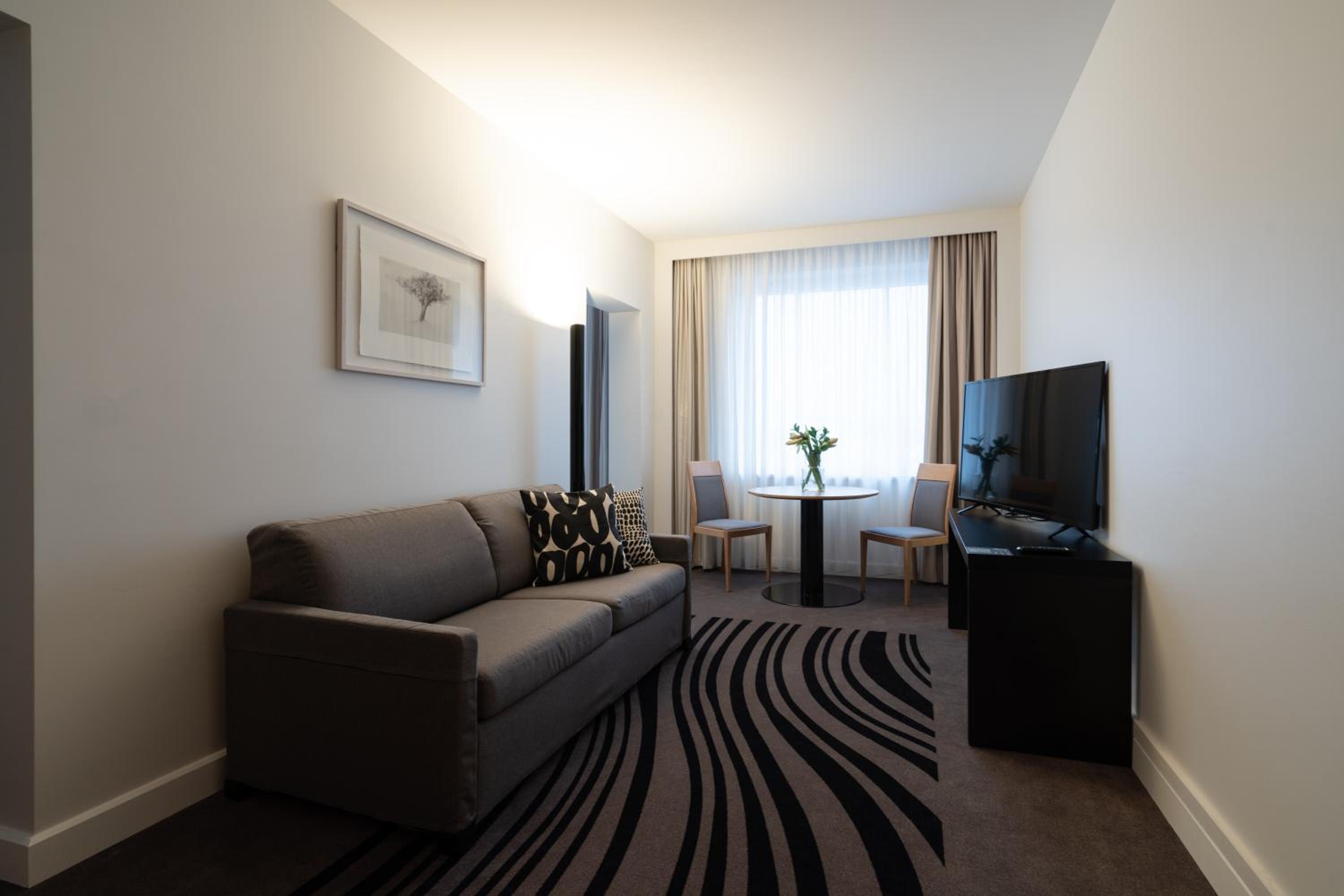 Queen Suite with Sofa in Living Room - Photo 7
