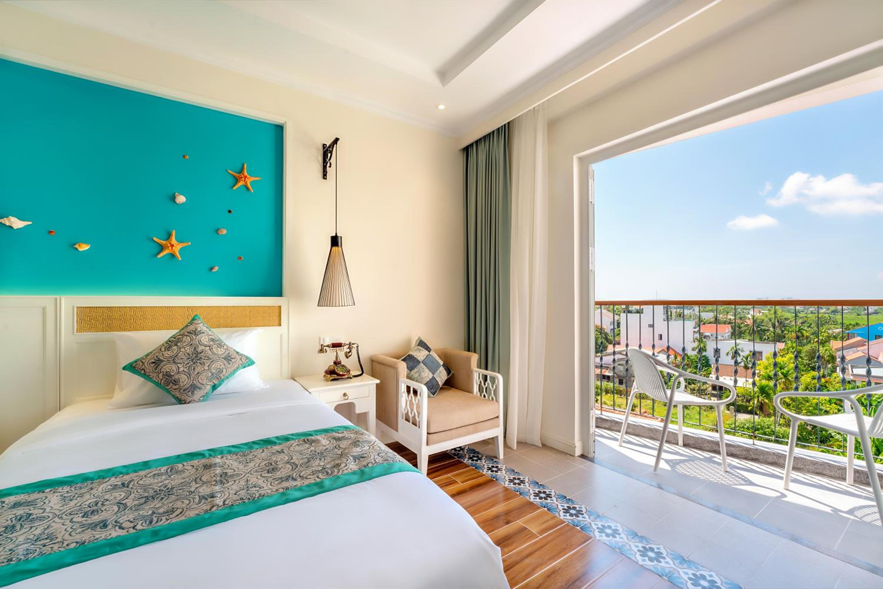 Deluxe Room with Pool/Village view and Balcony