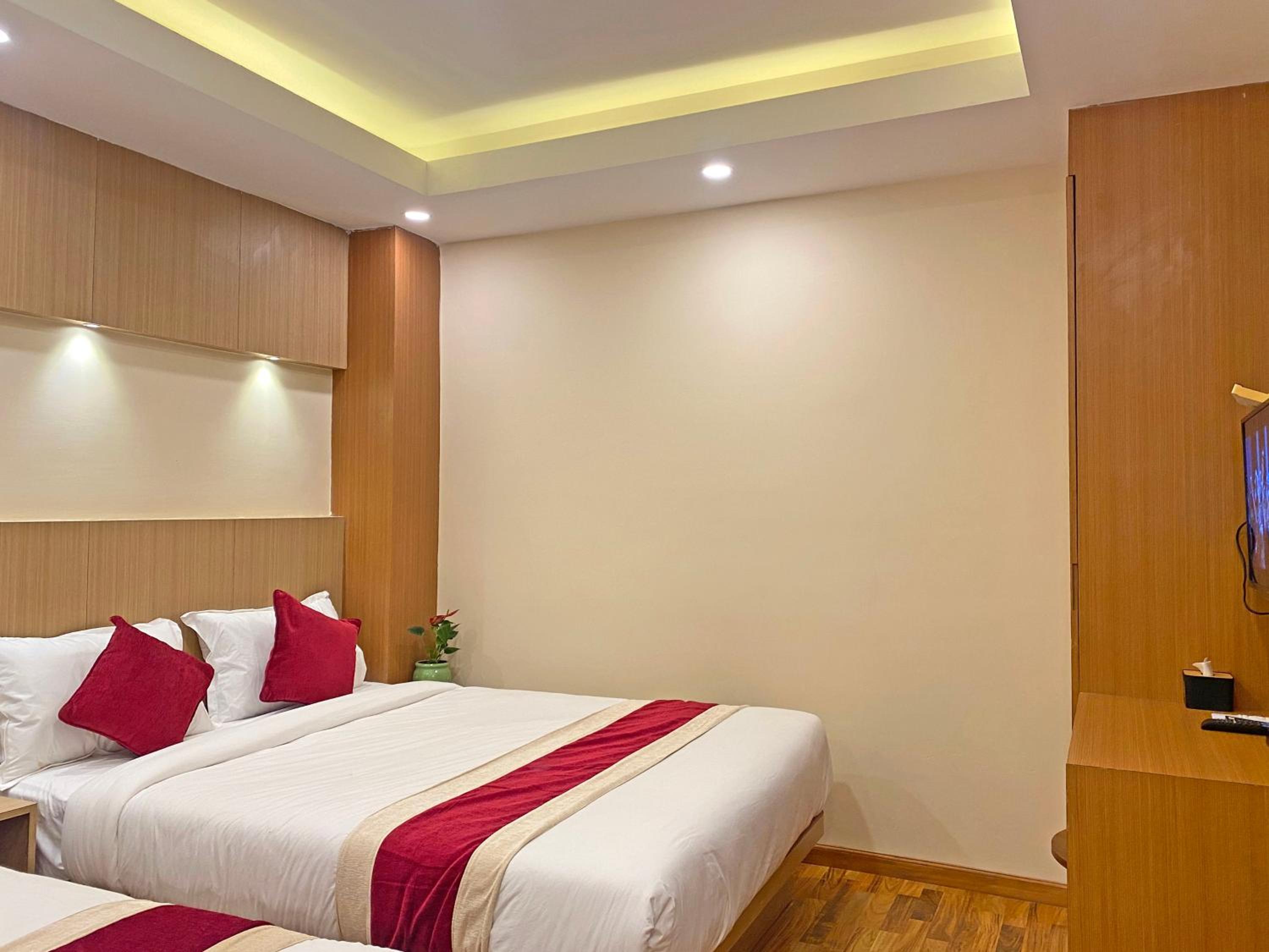 Deluxe Quadruple Room - Photo 13