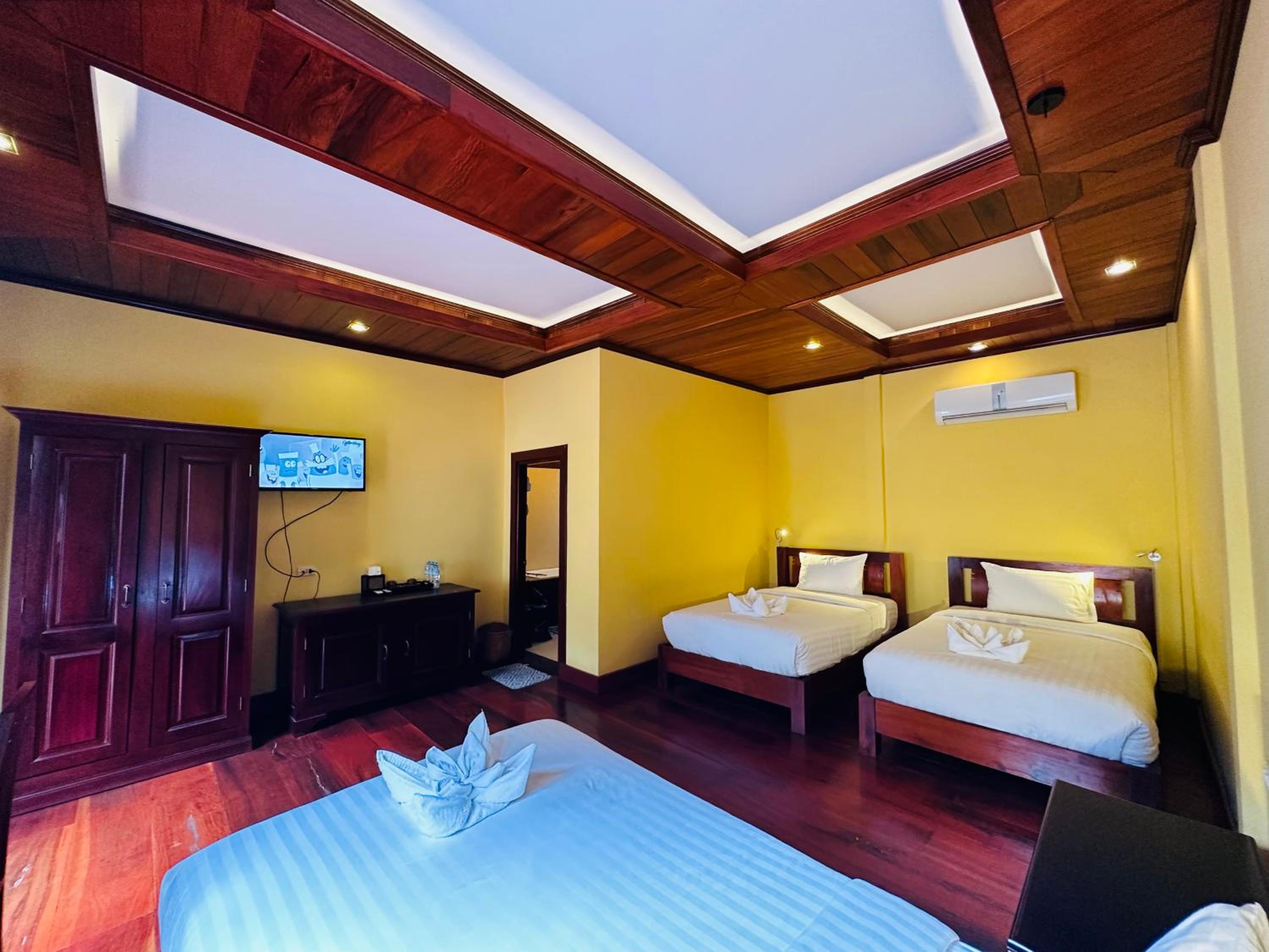 Deluxe Triple Room - Photo 18
