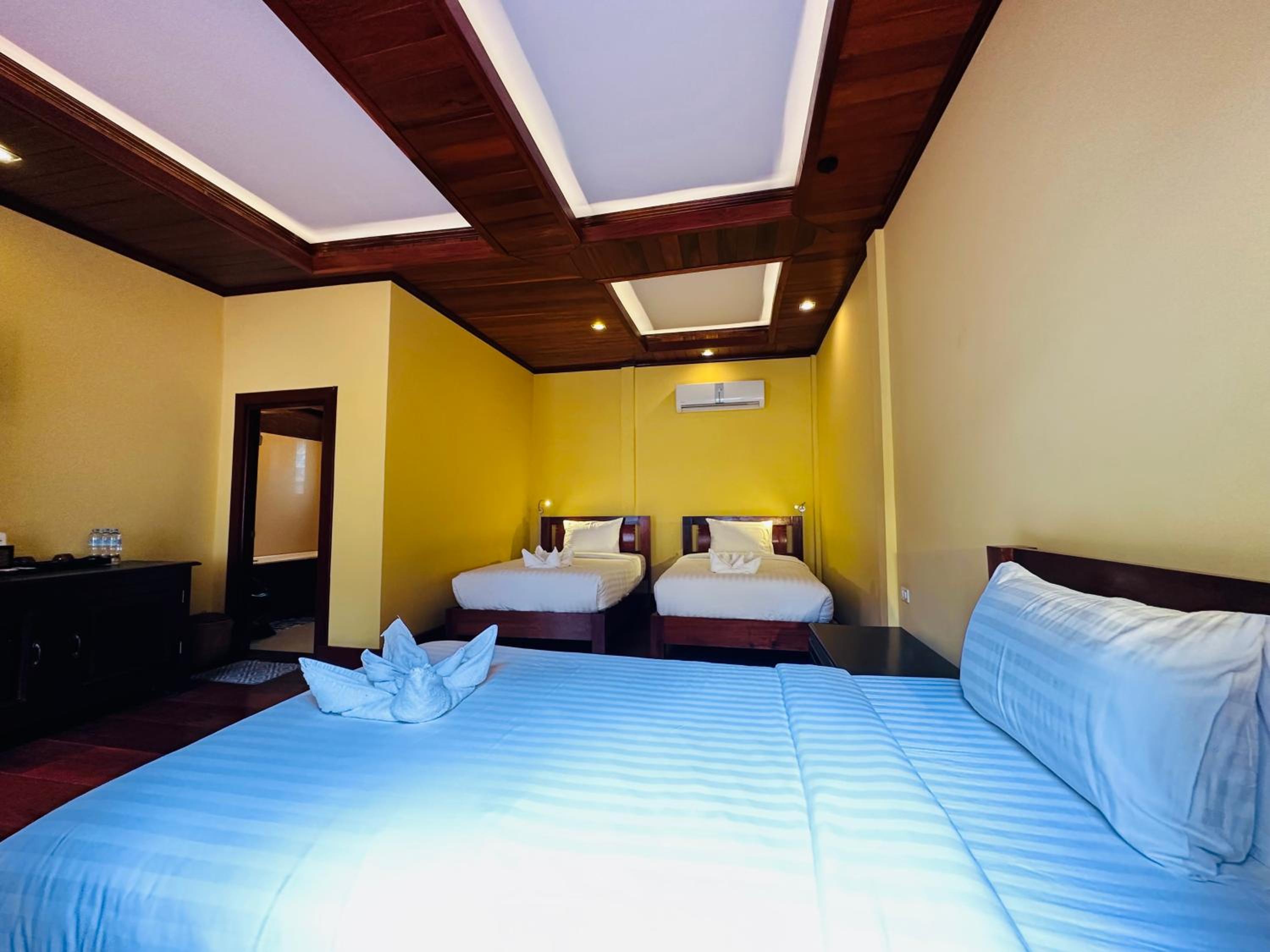 Deluxe Triple Room - Photo 13