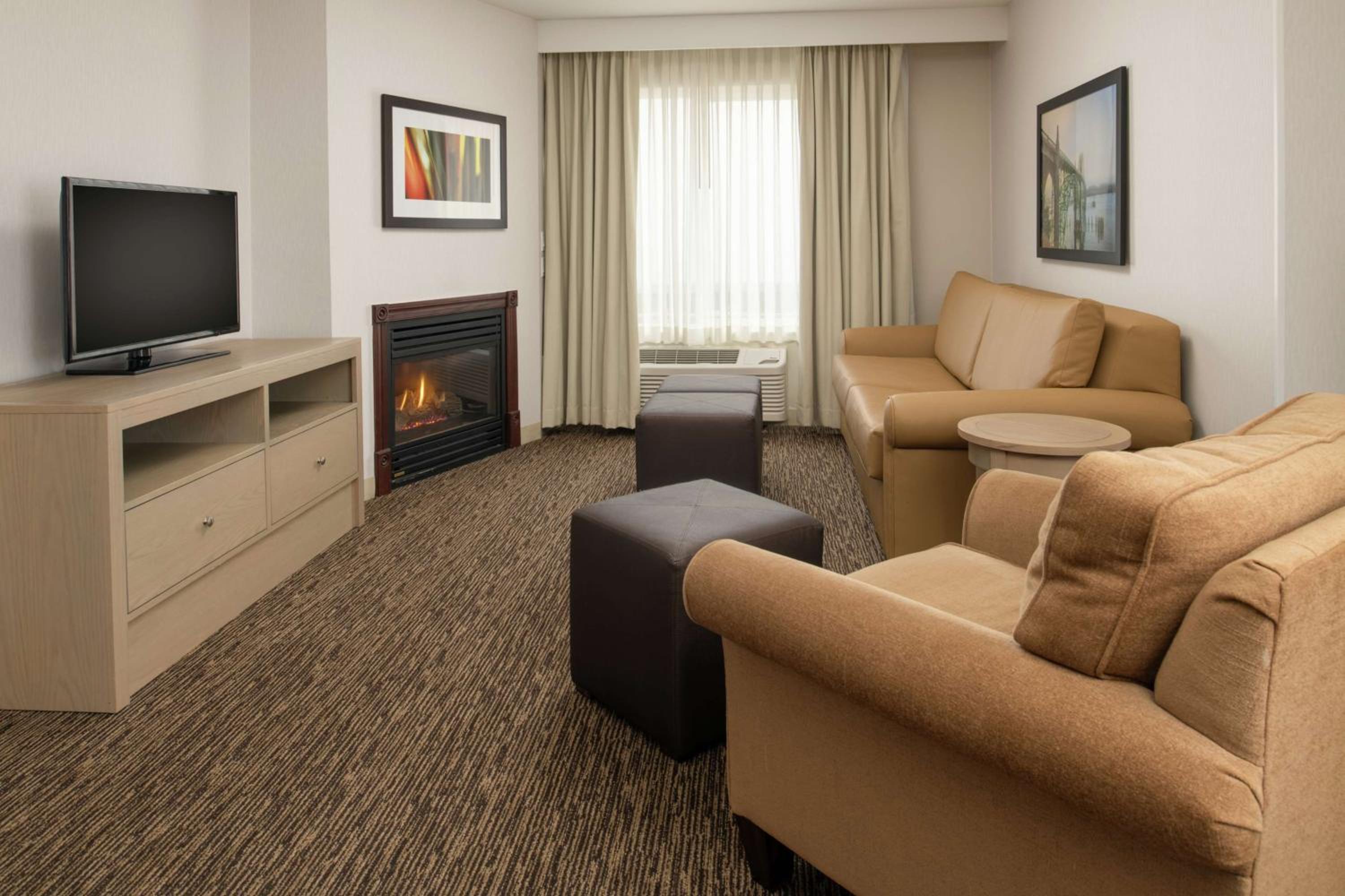 Junior King Suite with Fireplace at DoubleTree by Hilton Portland Tigard in Tigard