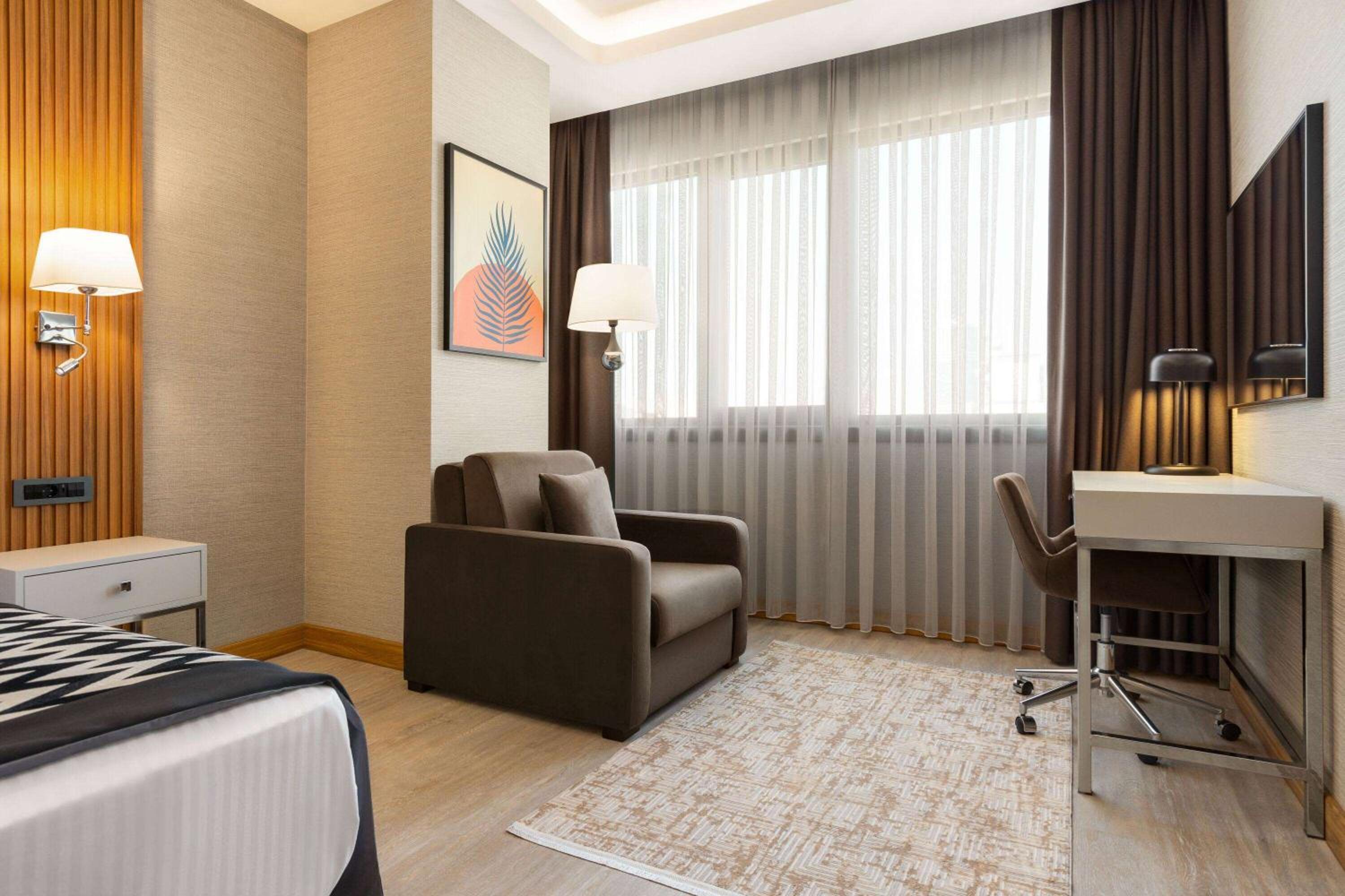 Deluxe Room with City View and Balcony