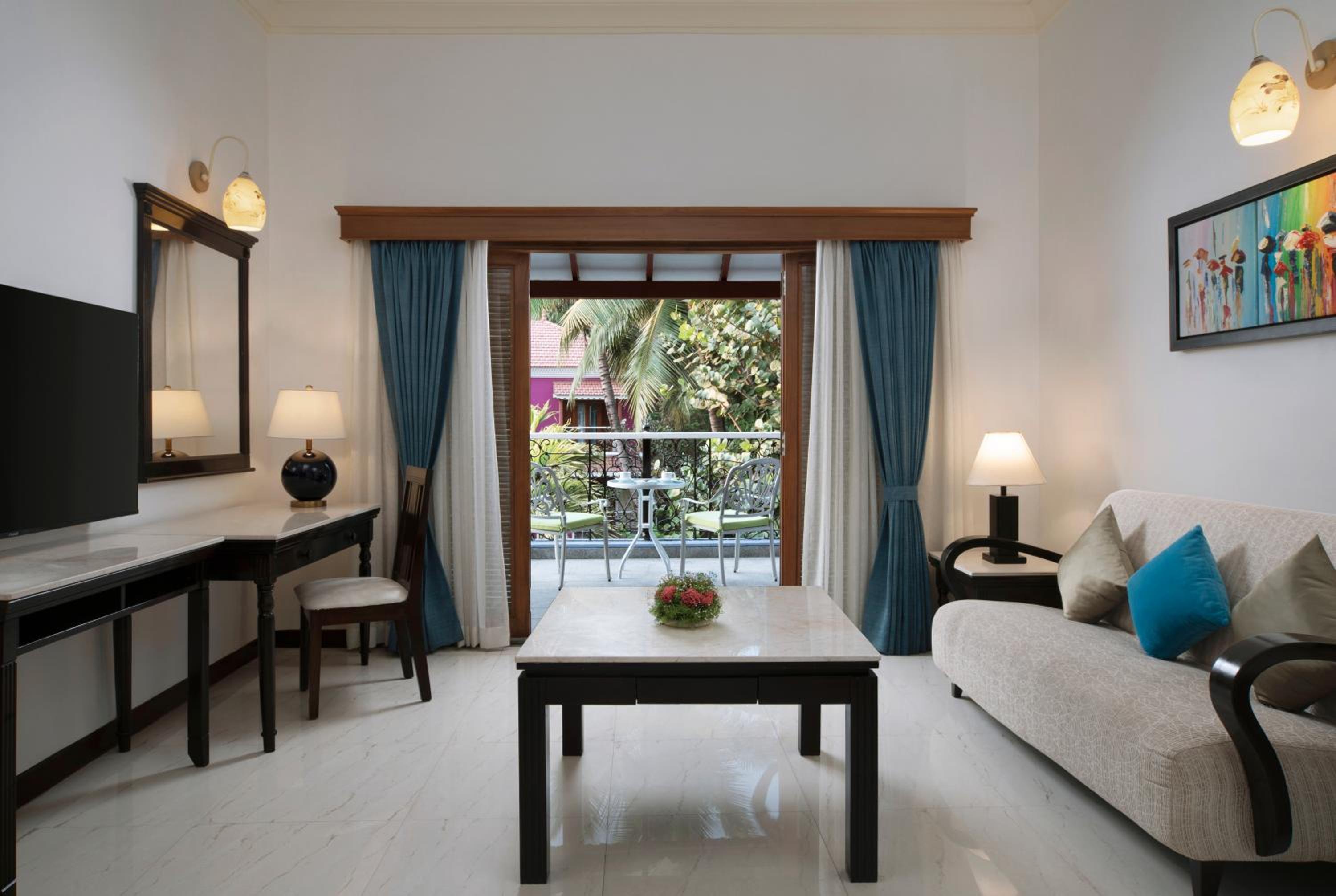 Radisson Suite with Balcony, Bathtub, Living room & Garden view - 10% Discount of Food & Beverages and SPA, 1 Goan Wine Bottle - Complimentary Hi-Tea (4:30 to 5:30pm), INR 500 Hotel Credit (minimum spend of INR 5000), Early Check-In upto 2 hours (subject