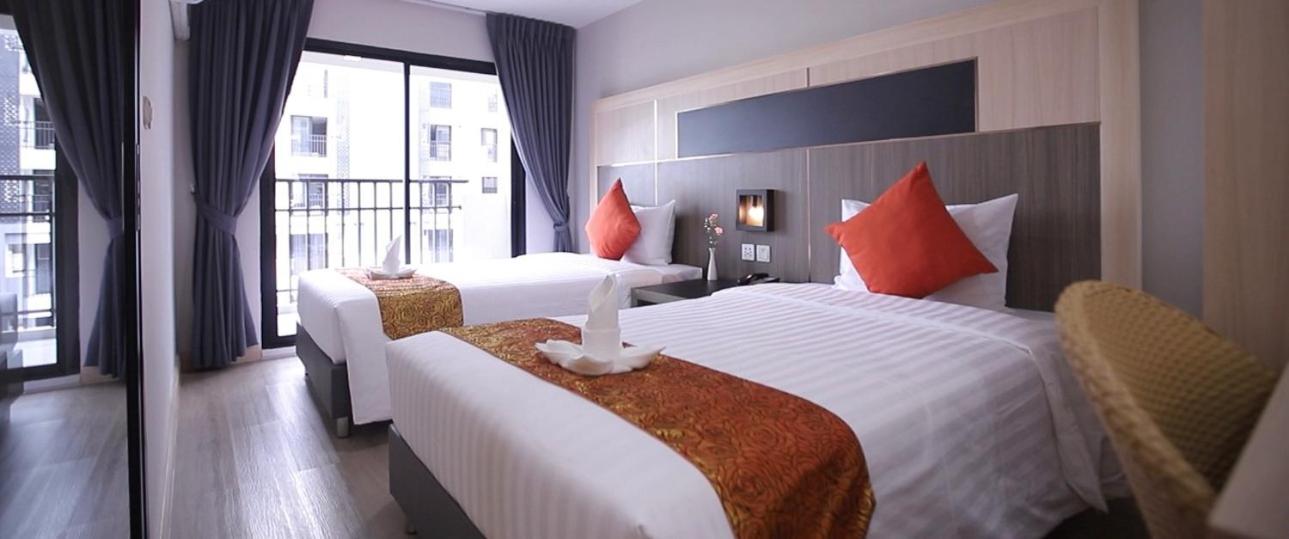 Habitación Doble Deluxe con Dos Camas Dobles