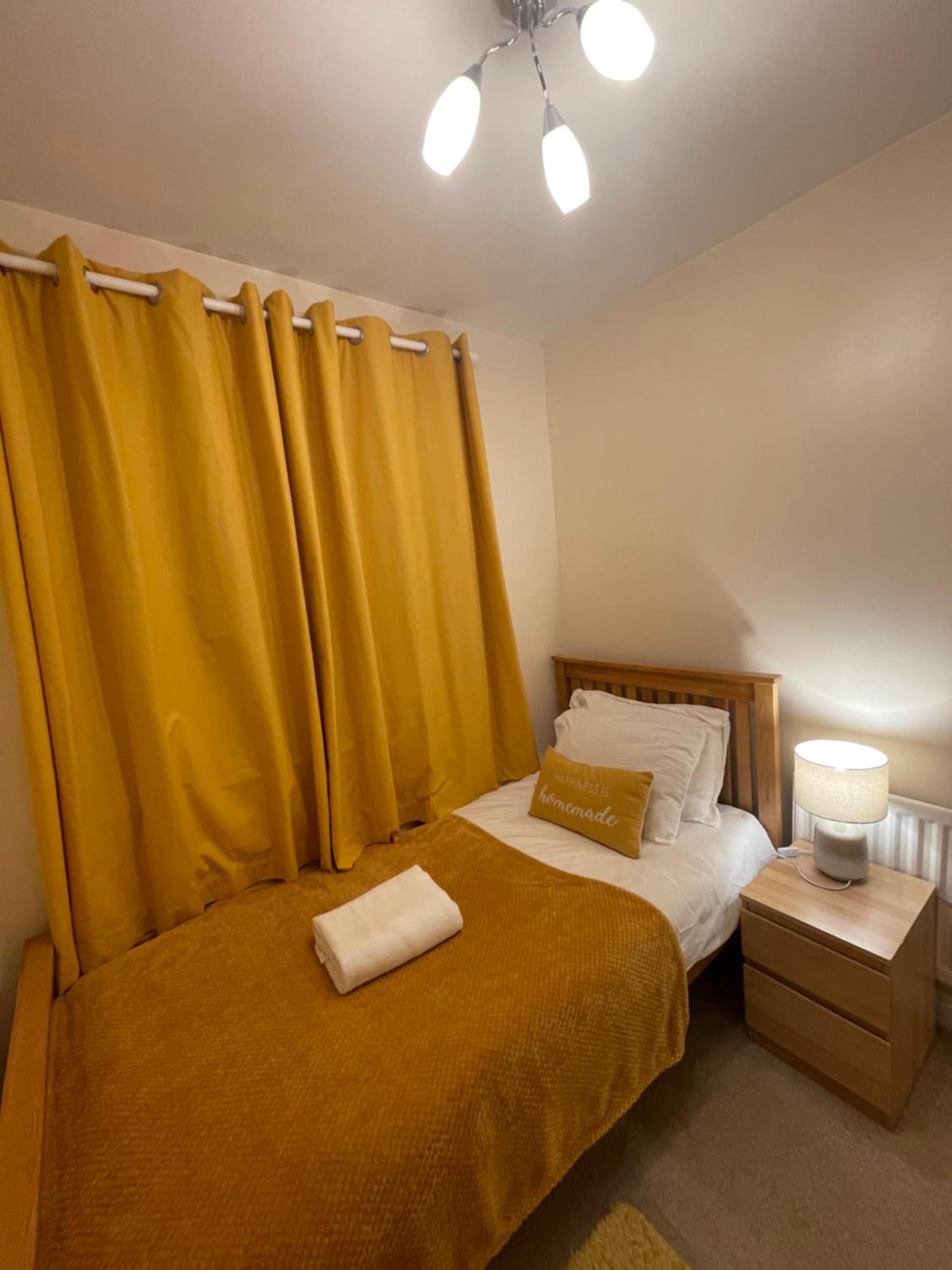 Three-Bedroom House - Photo 24