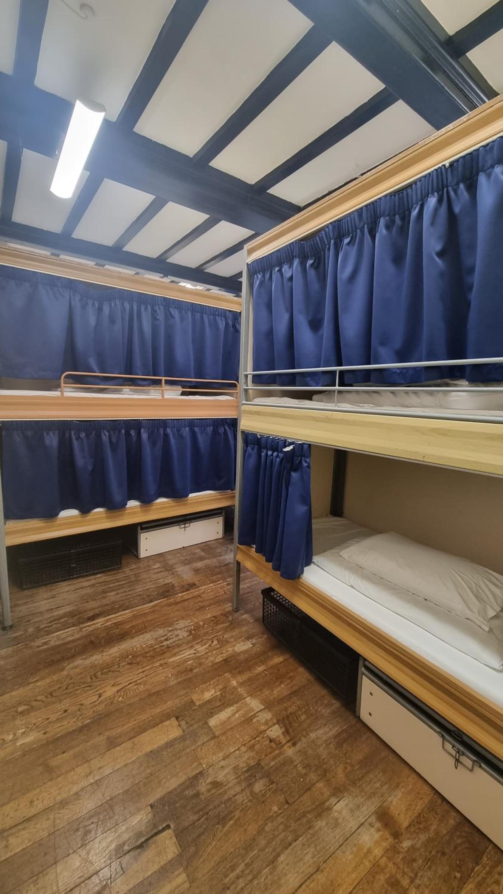 Bed in 18-Bed Mixed Dormitory Room with External Shared Bathroom photo 1