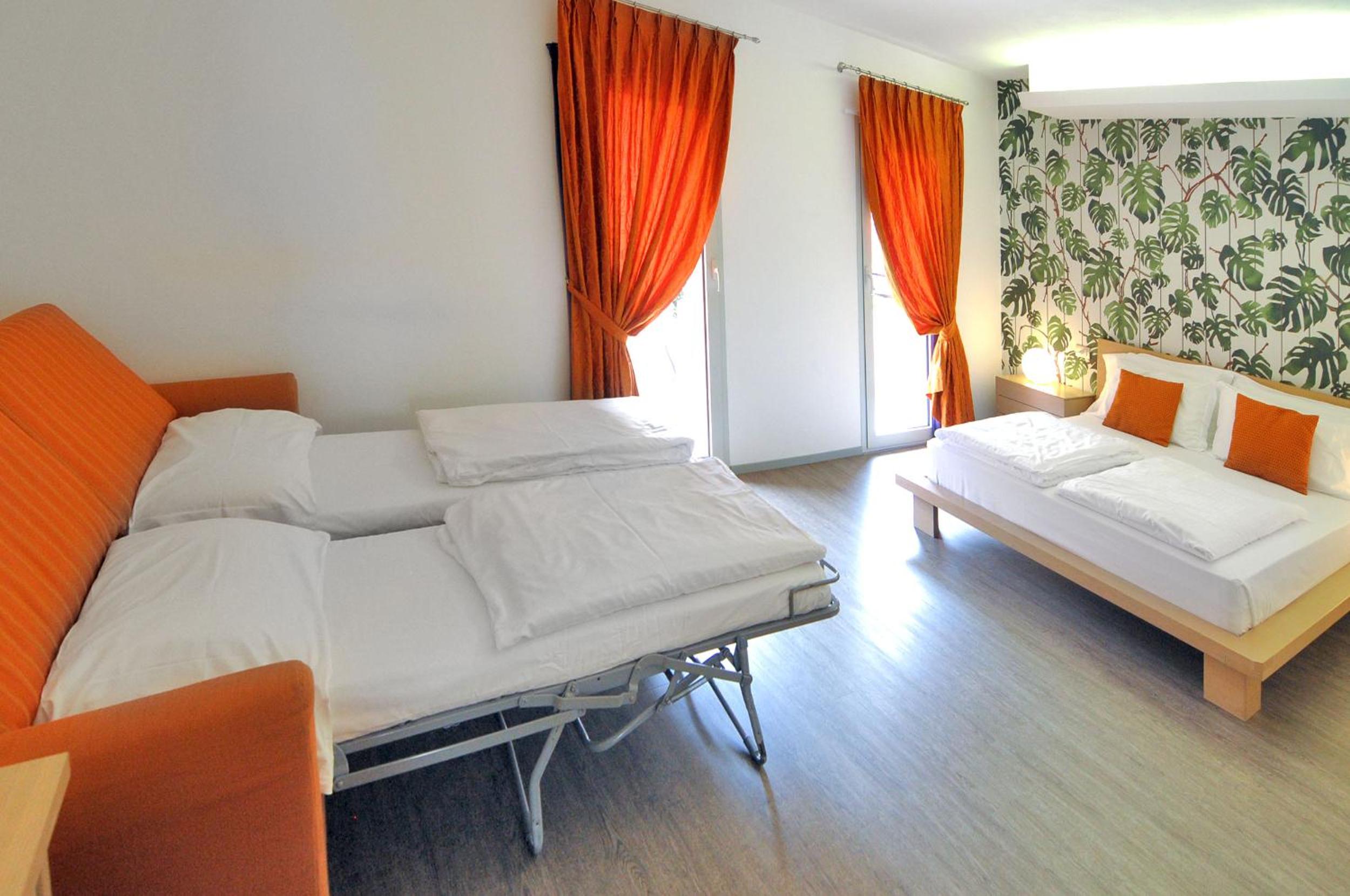 Quadruple Room with Balcony - Photo 1
