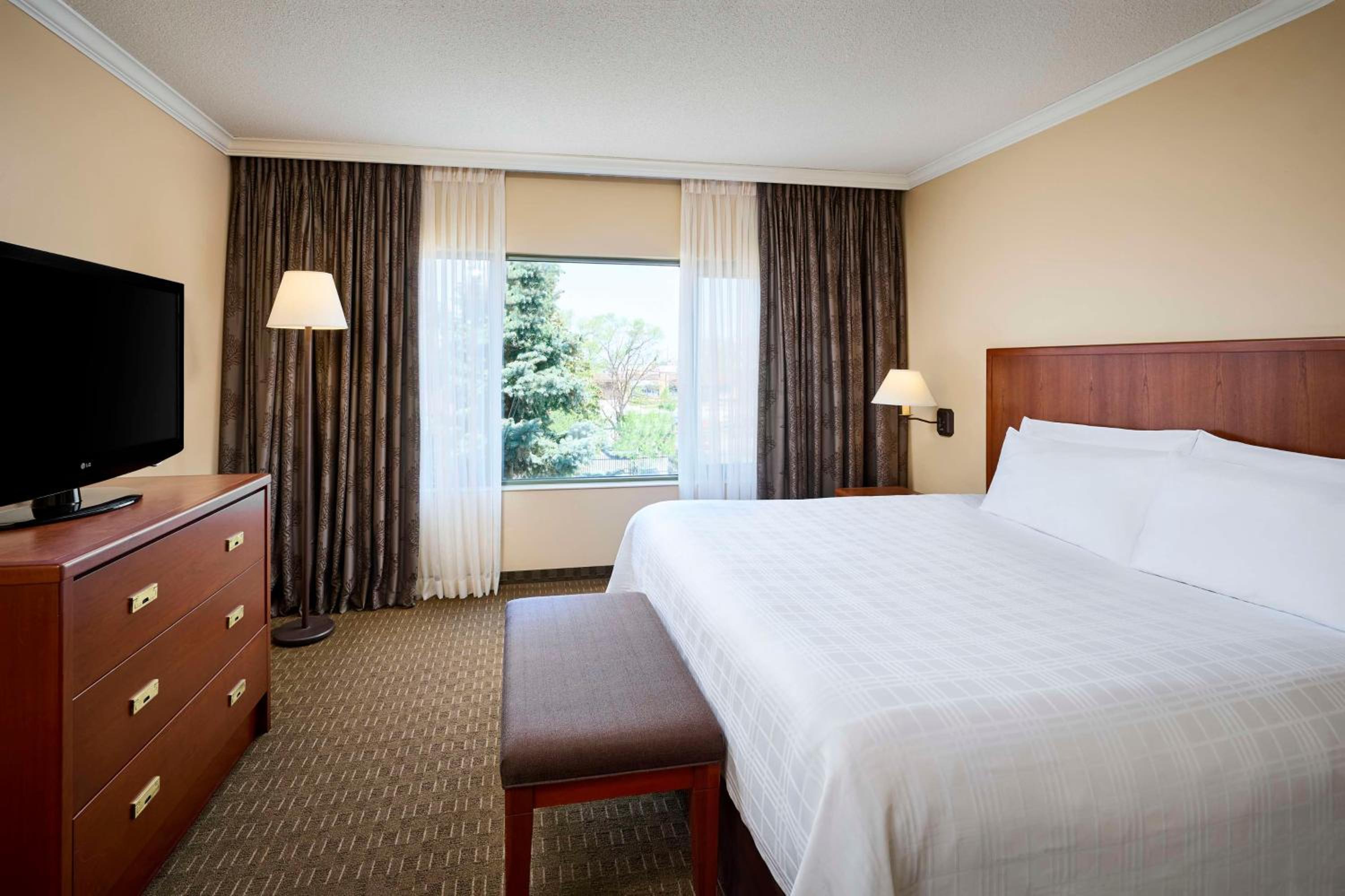 hotel room with a large bed and a flat screen tv