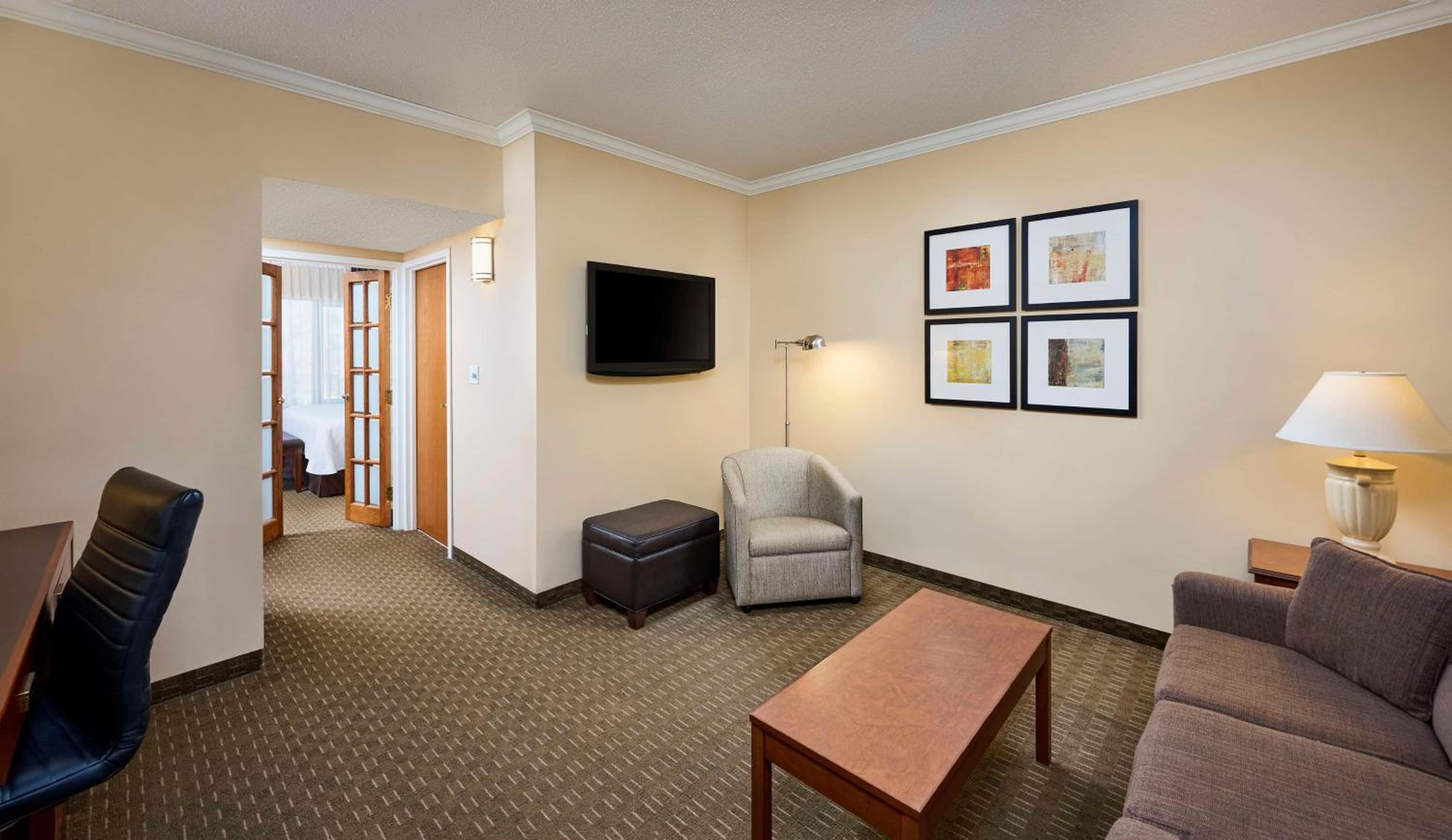 living room with couches and a flat screen tv