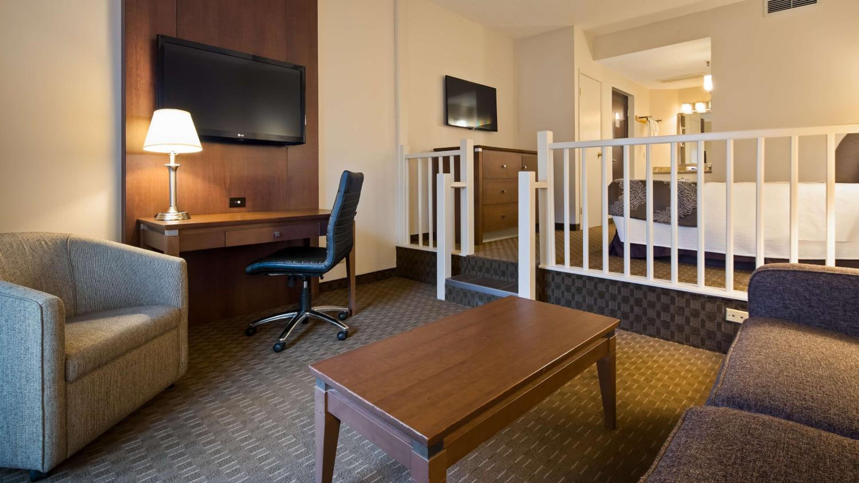 hotel room with a baby crib in the corner