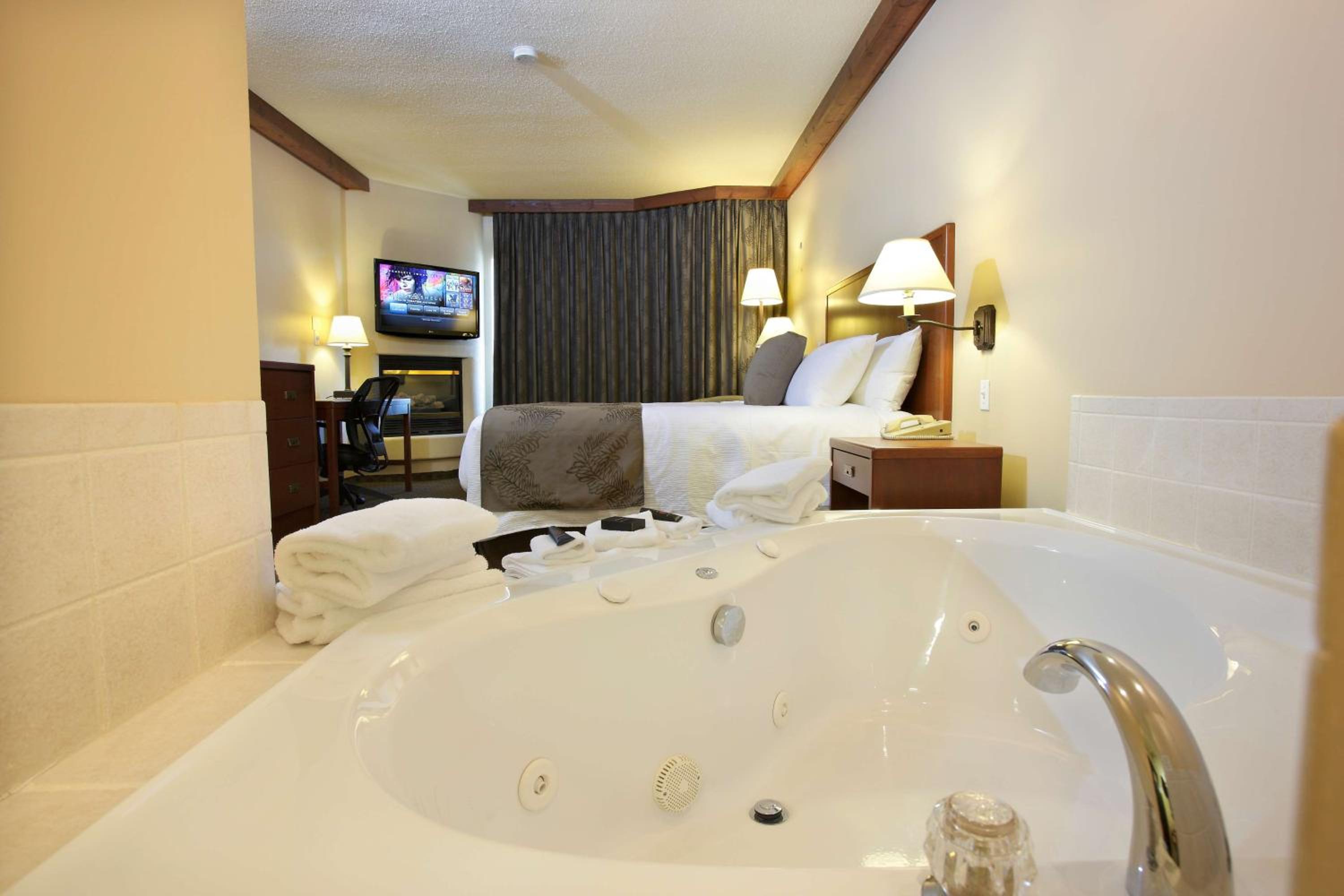 hotel room with a jacuzzi tub in it