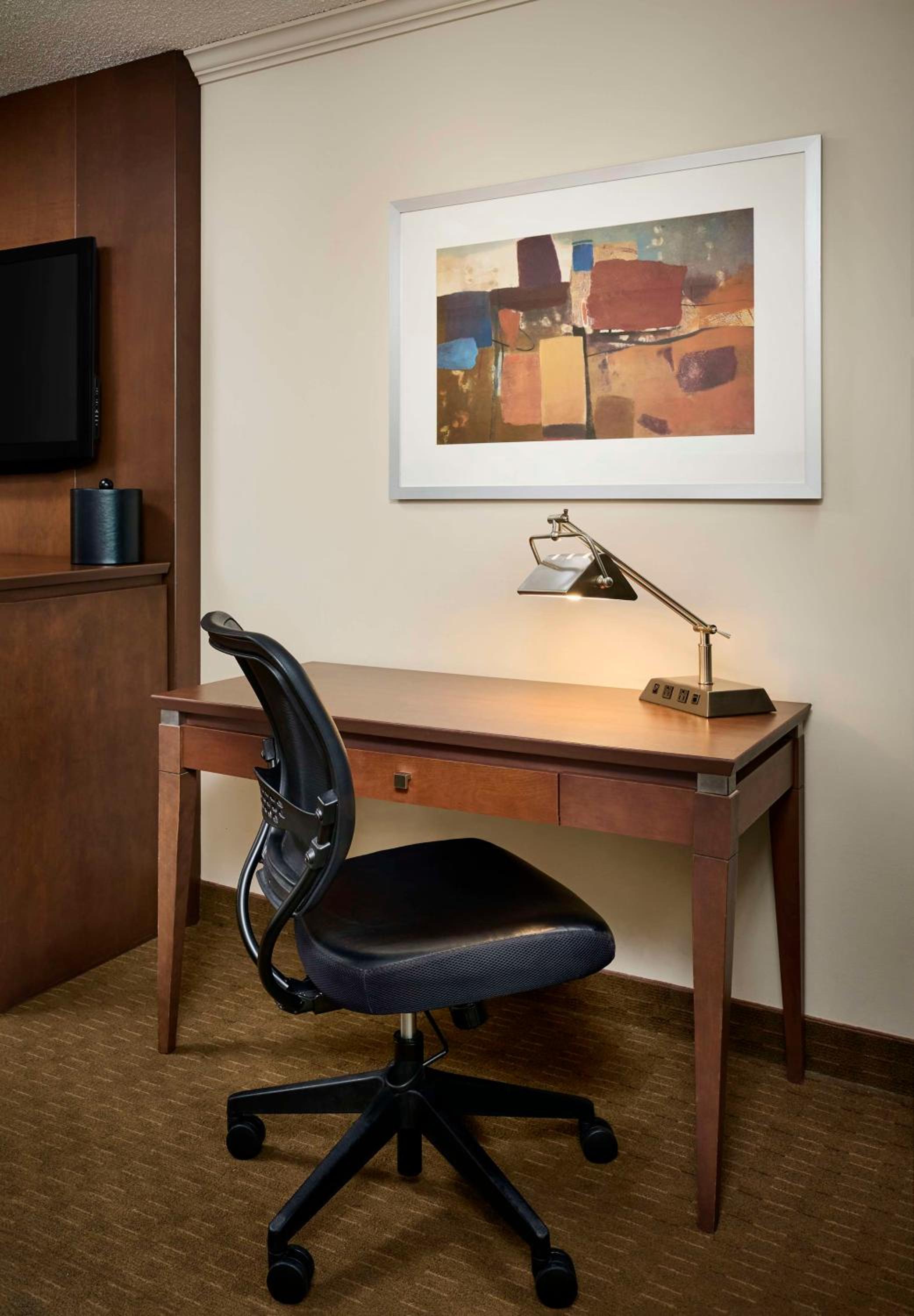 photograph of a desk with a chair in front of it