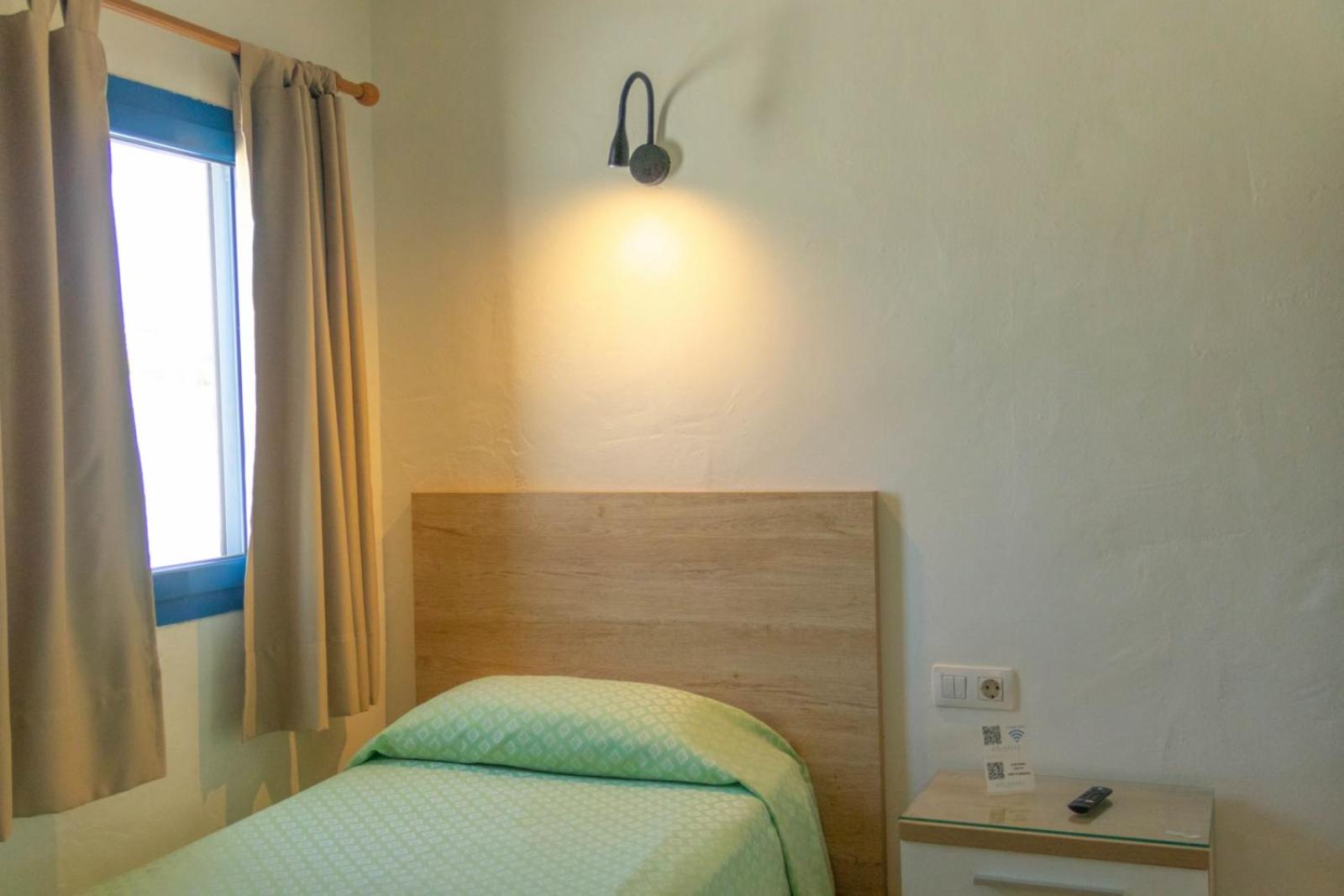 Habitación individual con baño compartido