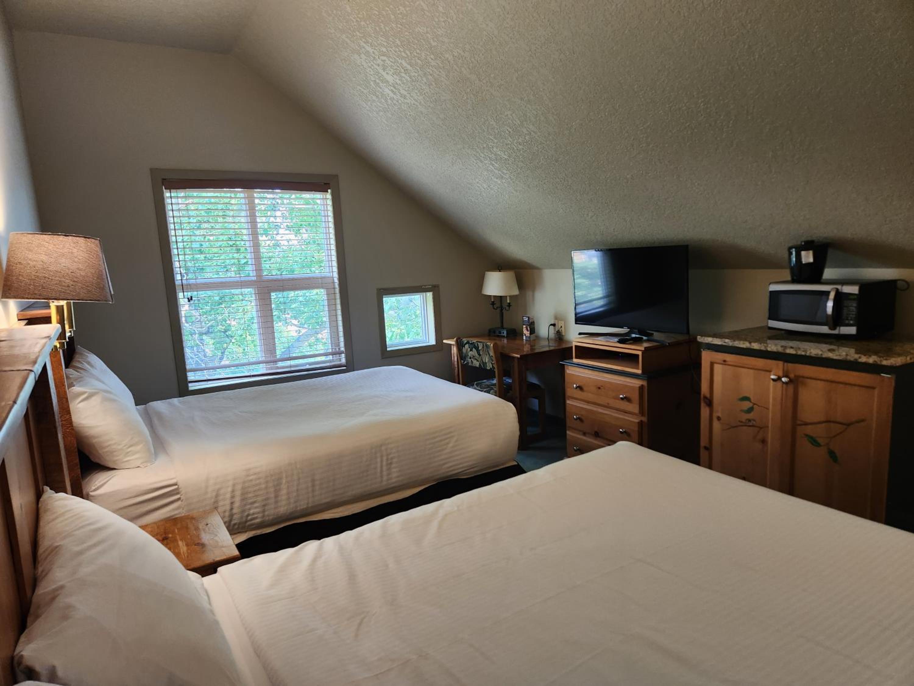 Queen Room with Two Queen Beds - Photo 1