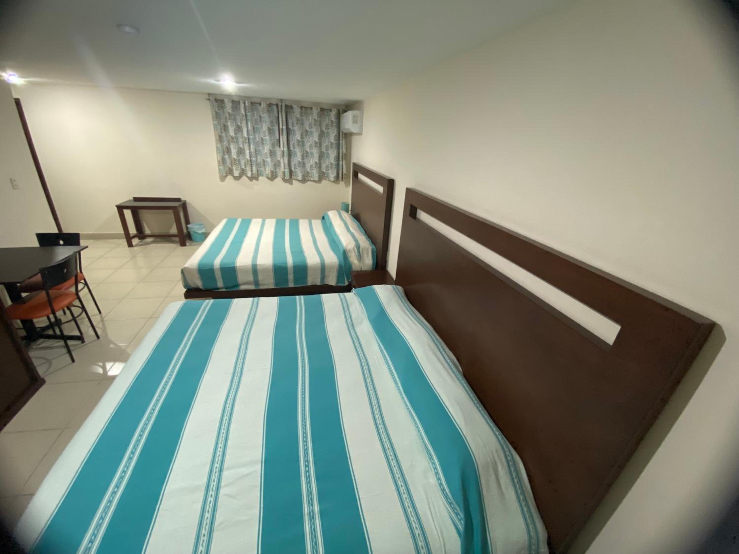 Deluxe Queen Room with Two Queen Beds photo 2