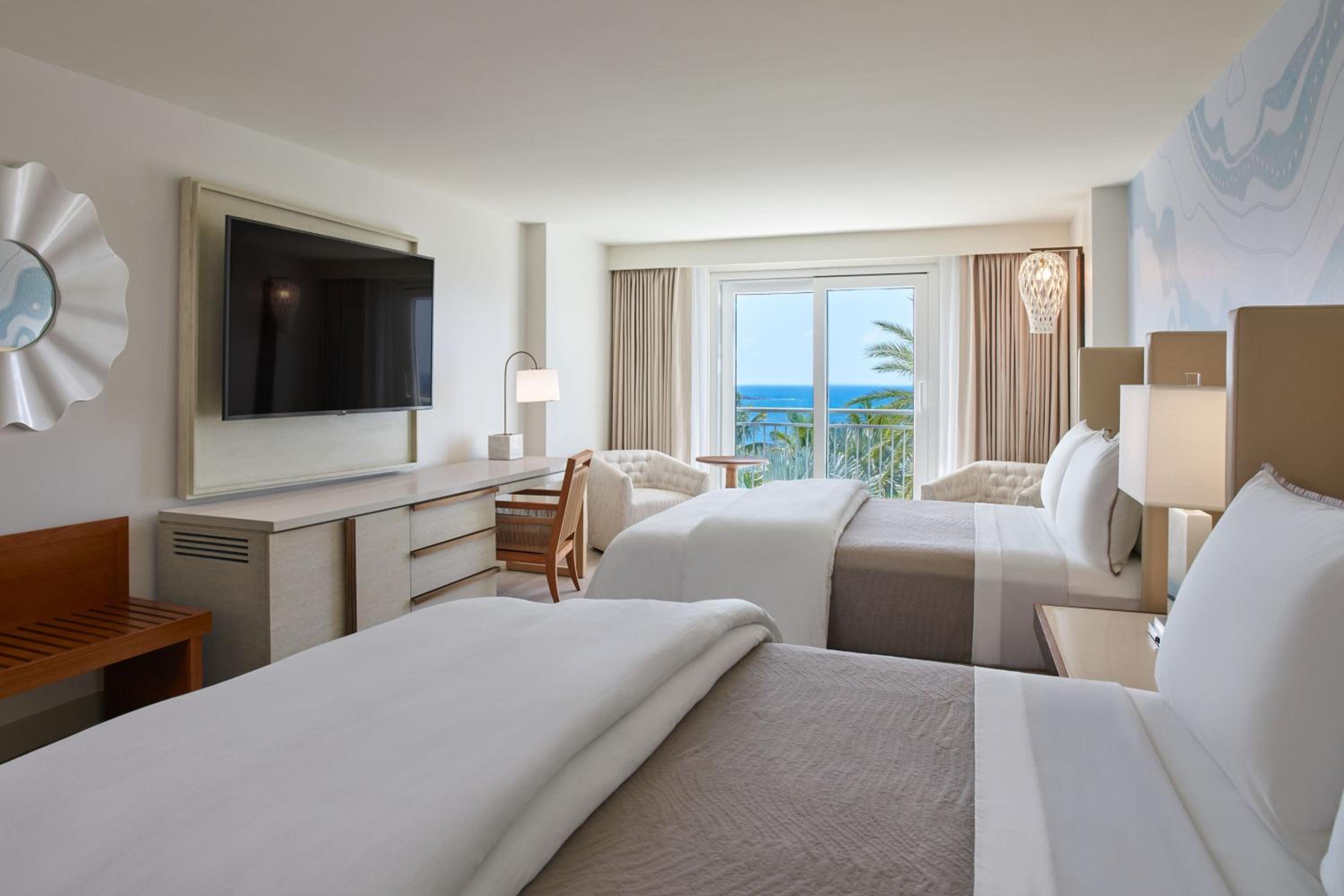 Queen Room with Two Queen Beds with Roll-In Shower and Partial Ocean View - Photo 1