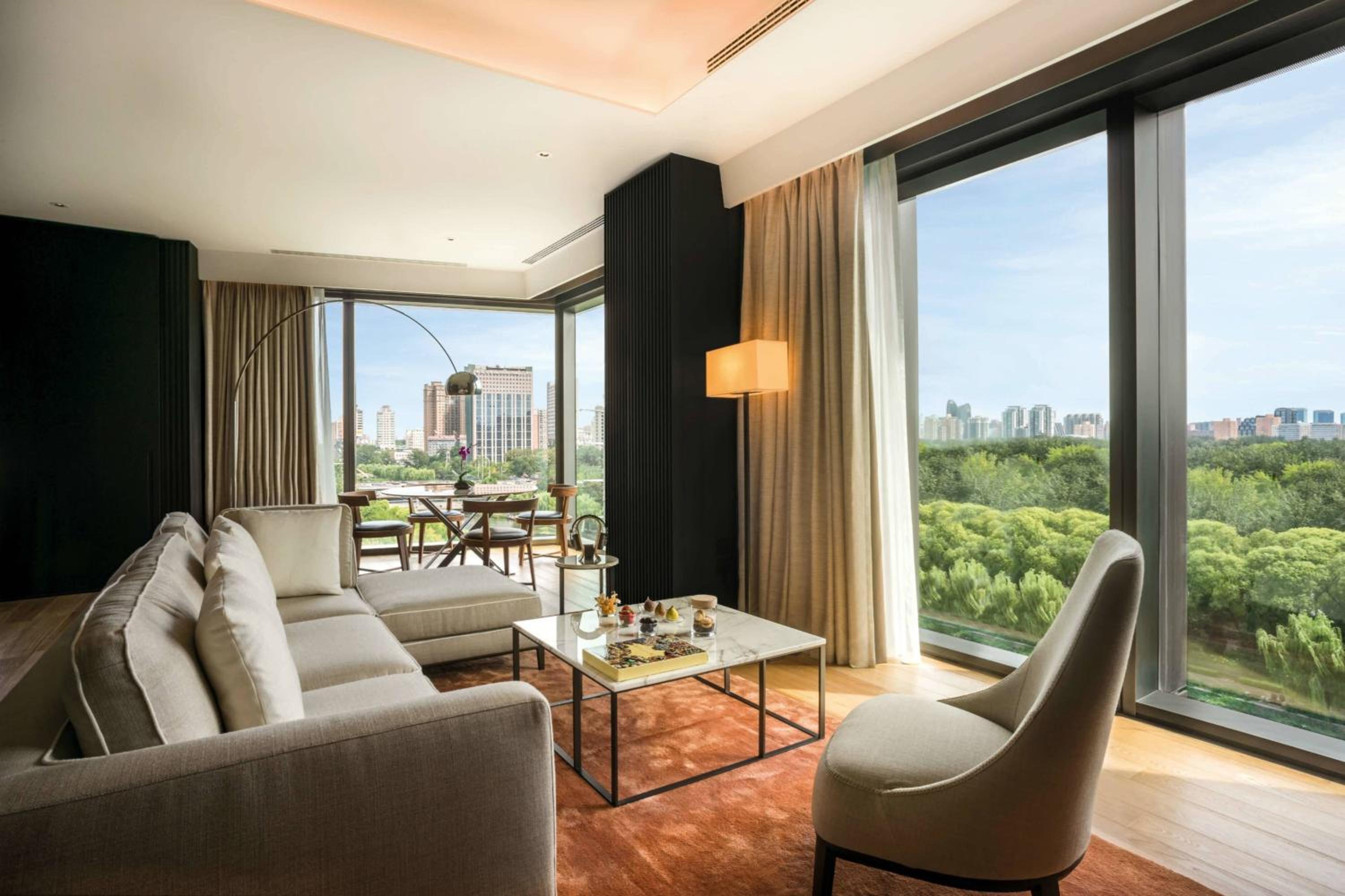 One-Bedroom Deluxe Suite with Liangma River View (Free Mini-bar soft drinks & beers + Two-way limousine services are available between the hotel and airport or train station in Beijing + unlimited laundry service) photo 1