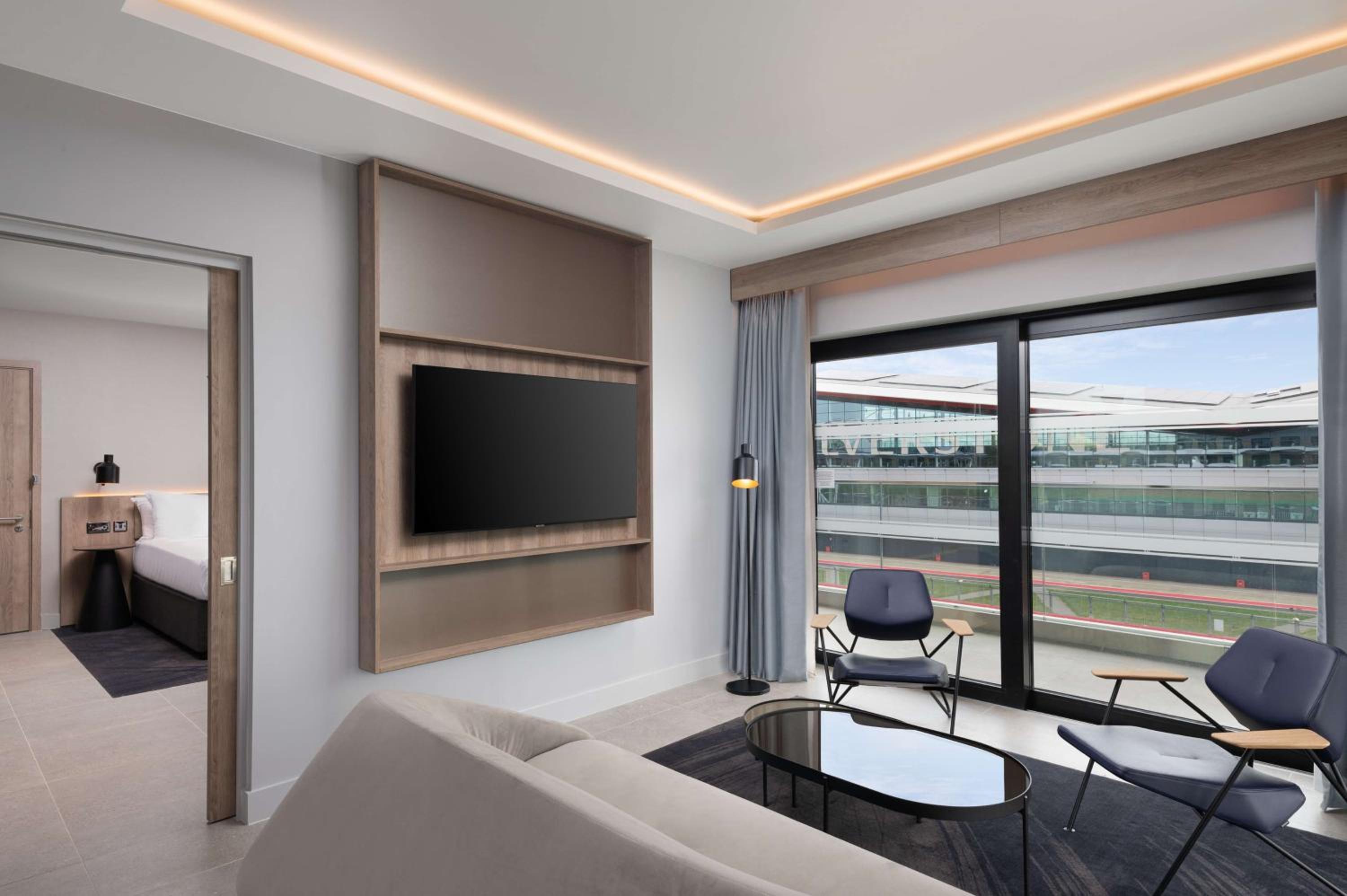 One Bedroom Suite with One King Bed and Balcony - Track Facing