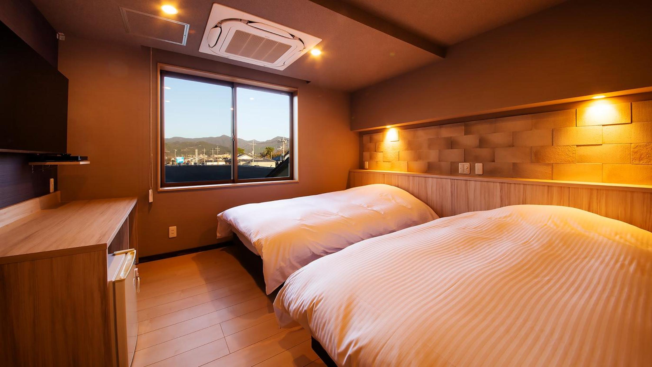 Modern Twin Room with Tatami Area and Semi Open-Air Hot Spring
