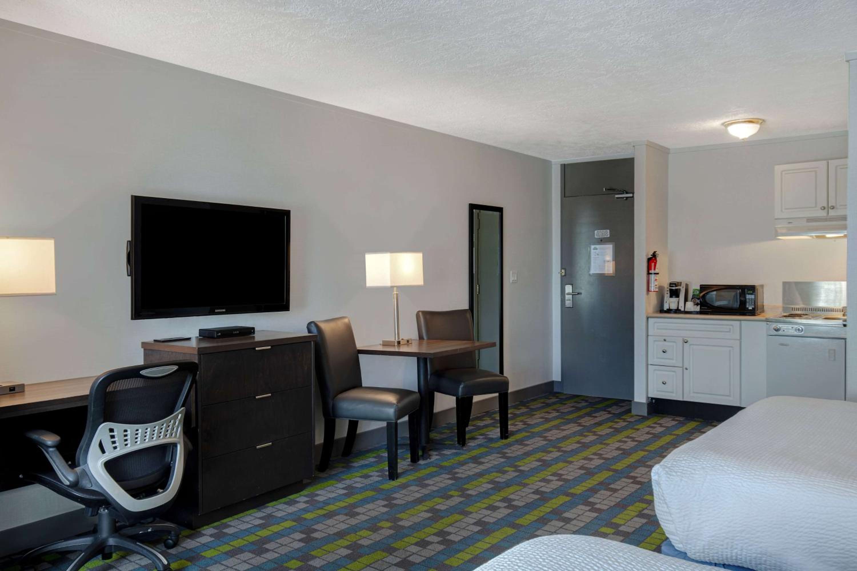 Deluxe Efficiency Room with Two Queen Beds, Non-Smoking - Photo 1