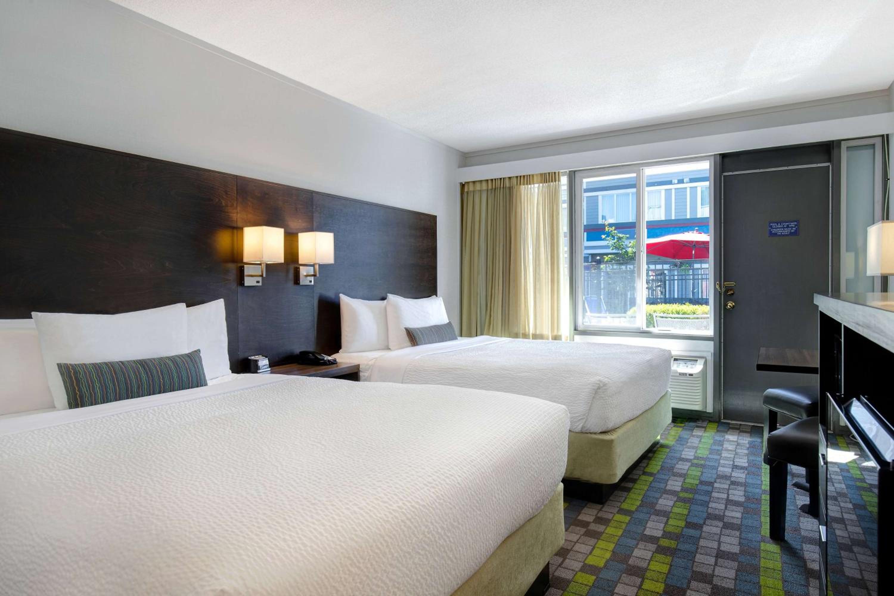 Superior Queen Room with Two Queen Beds and Pool View - Non-Smoking - Photo 1