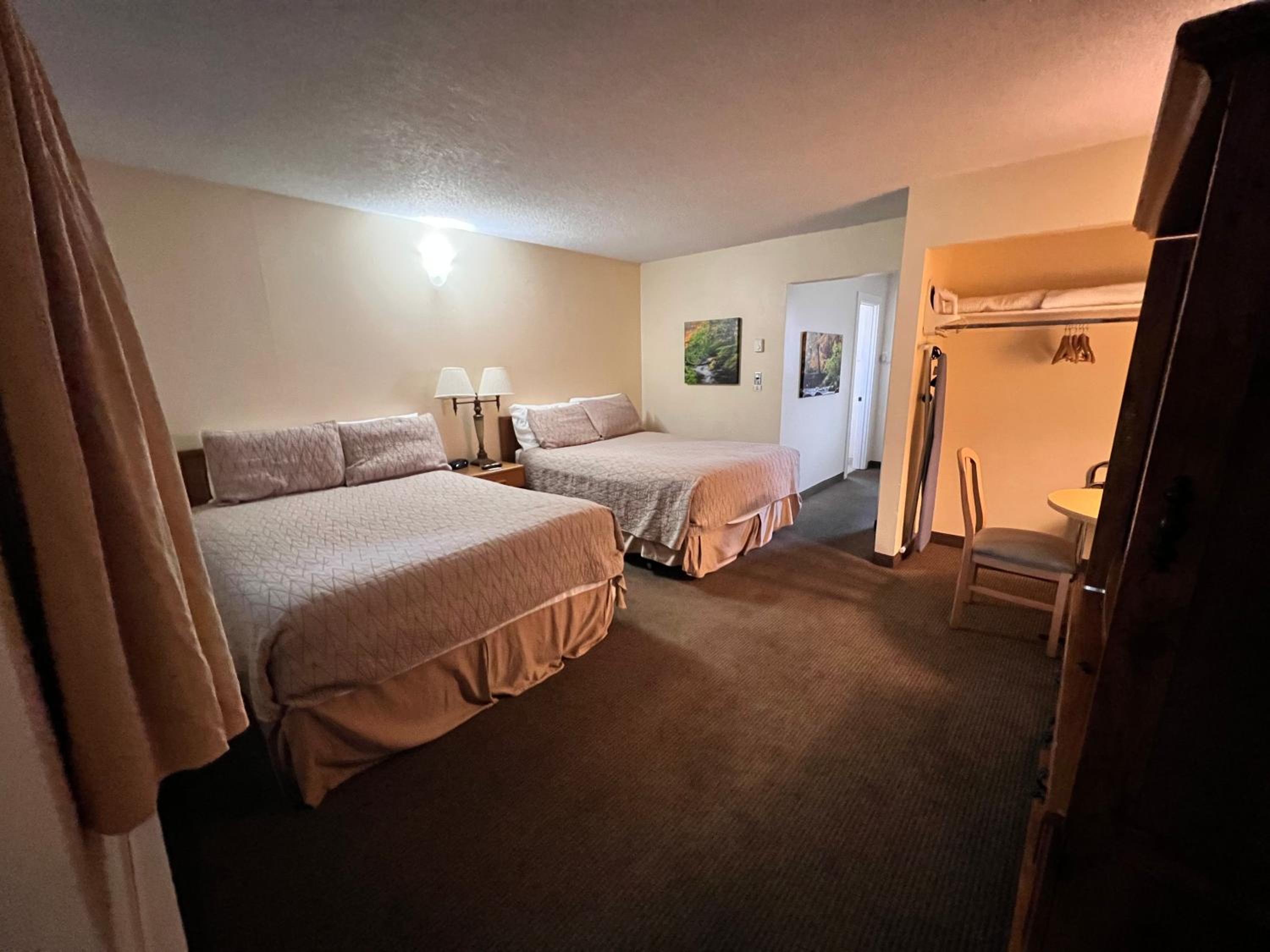 Queen Room with Three Queen Beds - No Pets Allowed - Photo 1