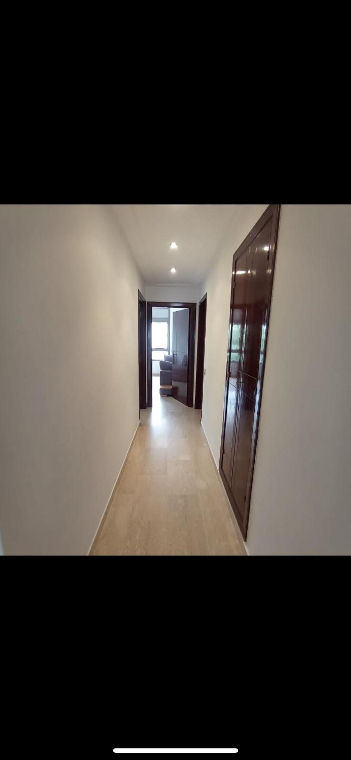Three-Bedroom Apartment photo 1