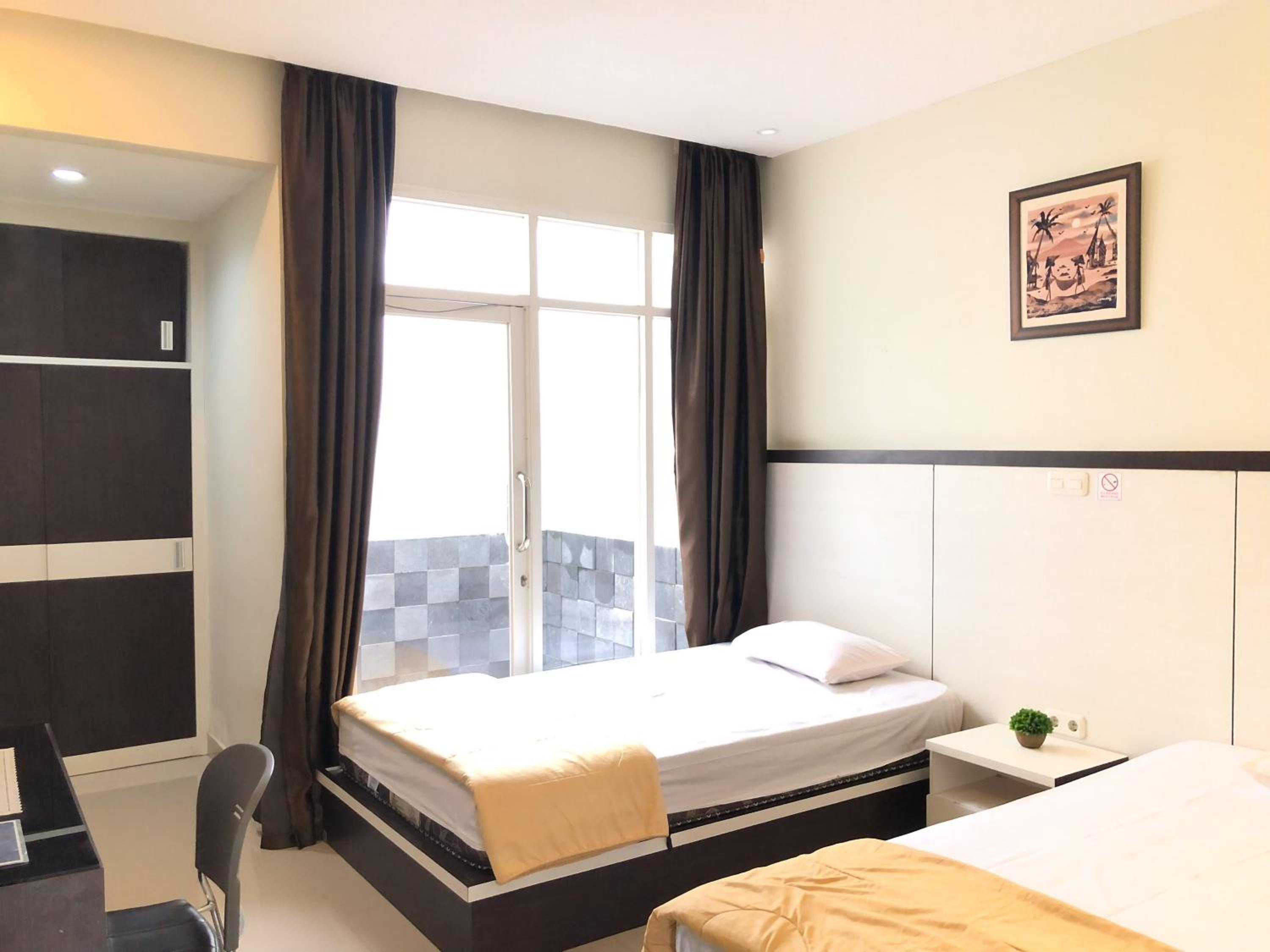 Standard Twin Room - Photo 4