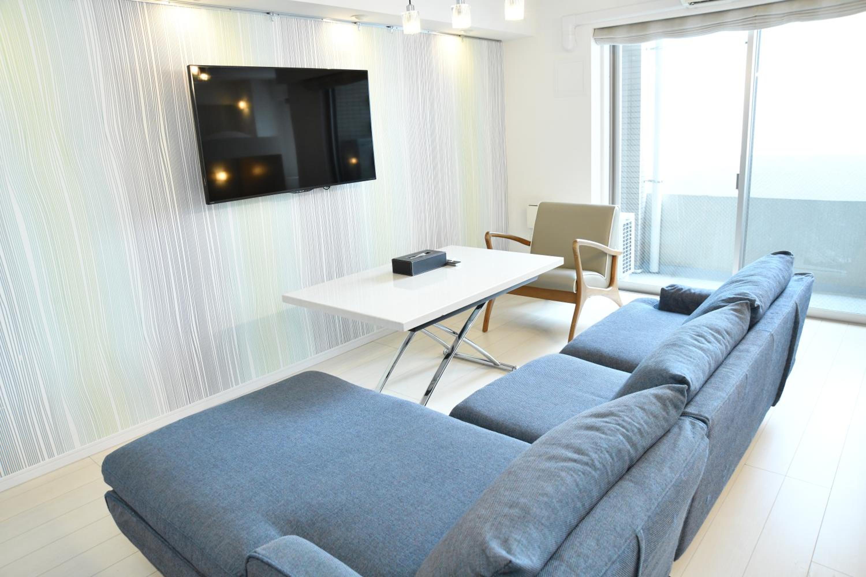 Quadruple Room with Couch photo 3