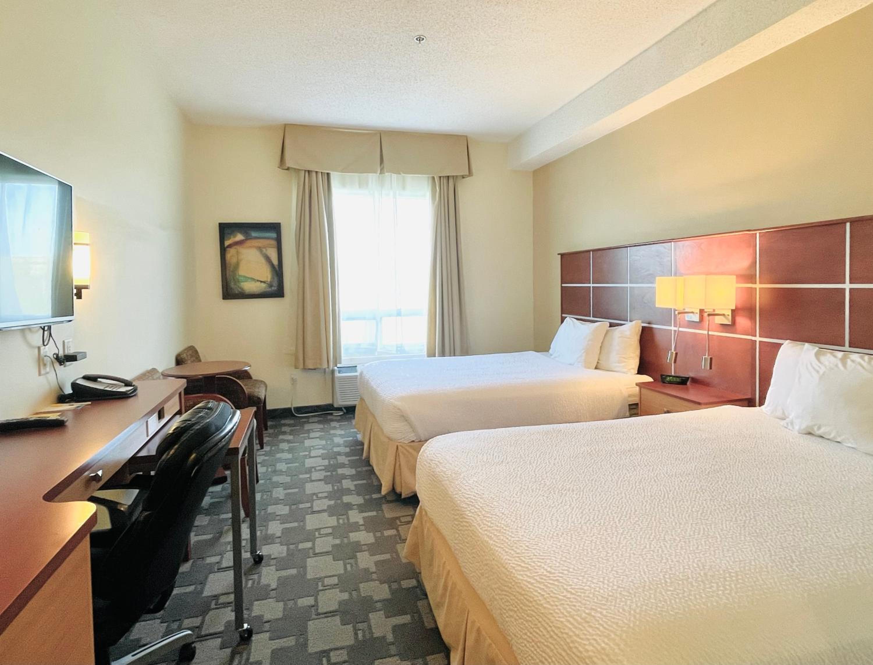 Queen Room with Two Queen Beds - Non-Smoking - Photo 1