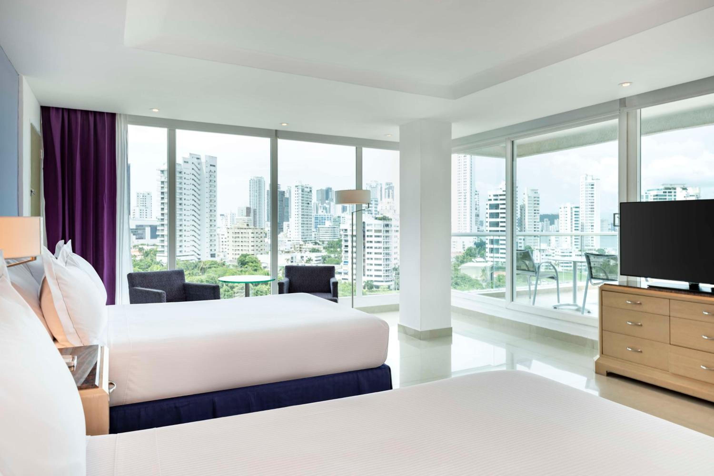 Two Queen Beds Corner Suite with City /Ocean View photo 1