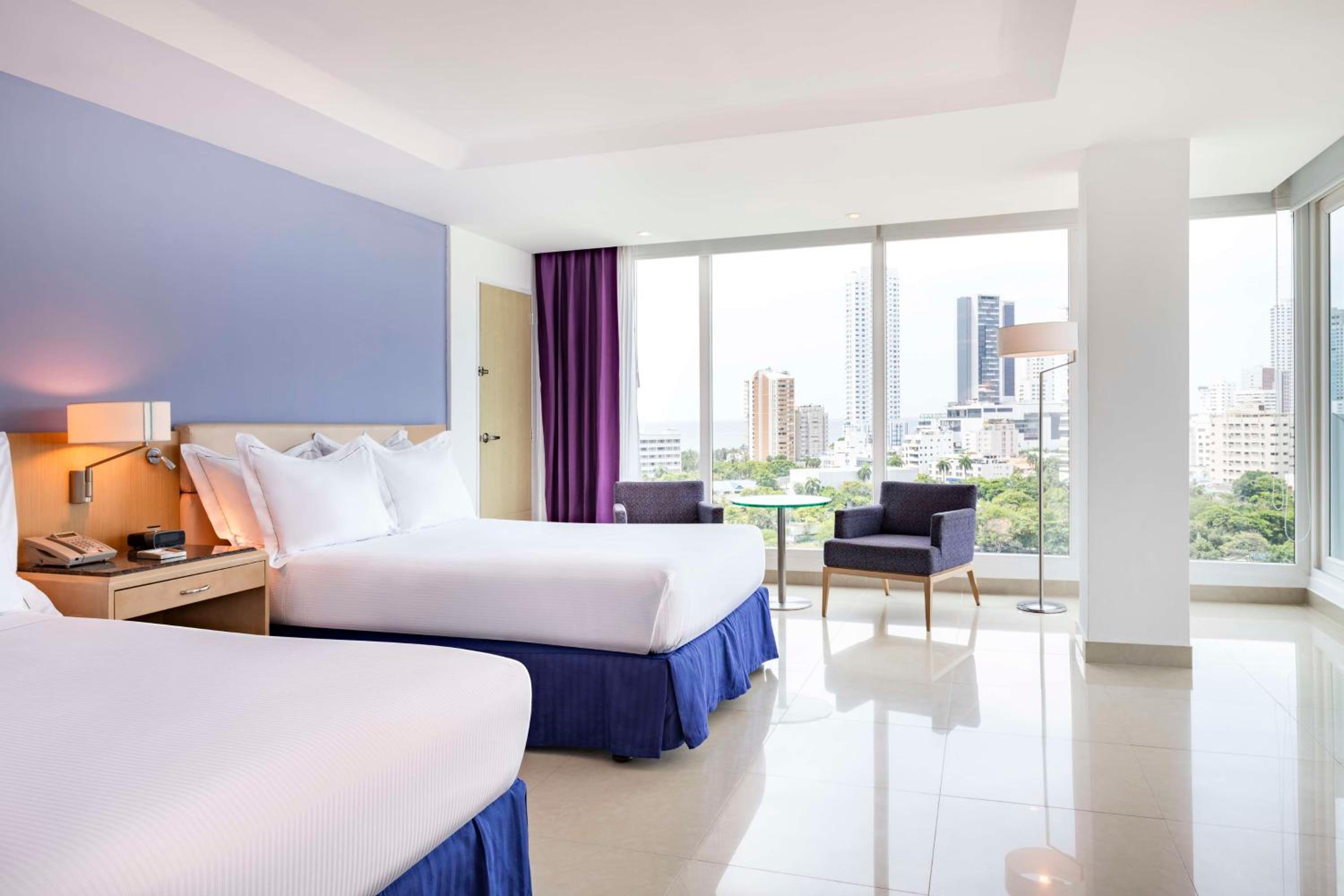 Two Queen Beds Corner Suite with City /Ocean View photo 3