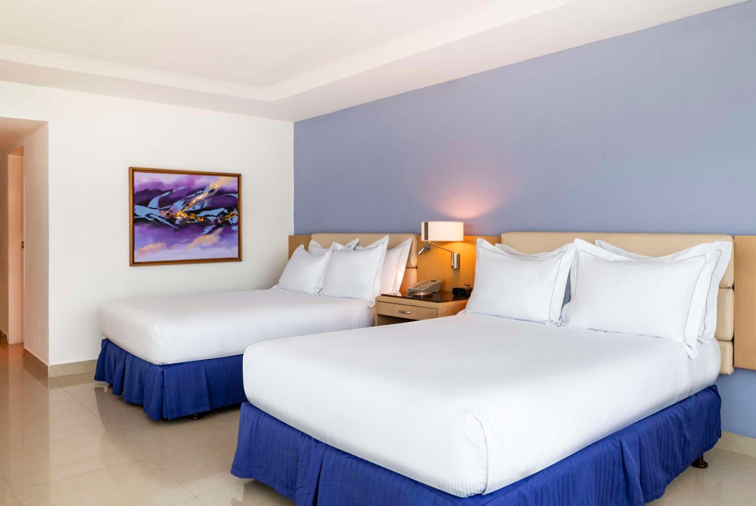 Two Queen Beds Corner Suite with City /Ocean View photo 2