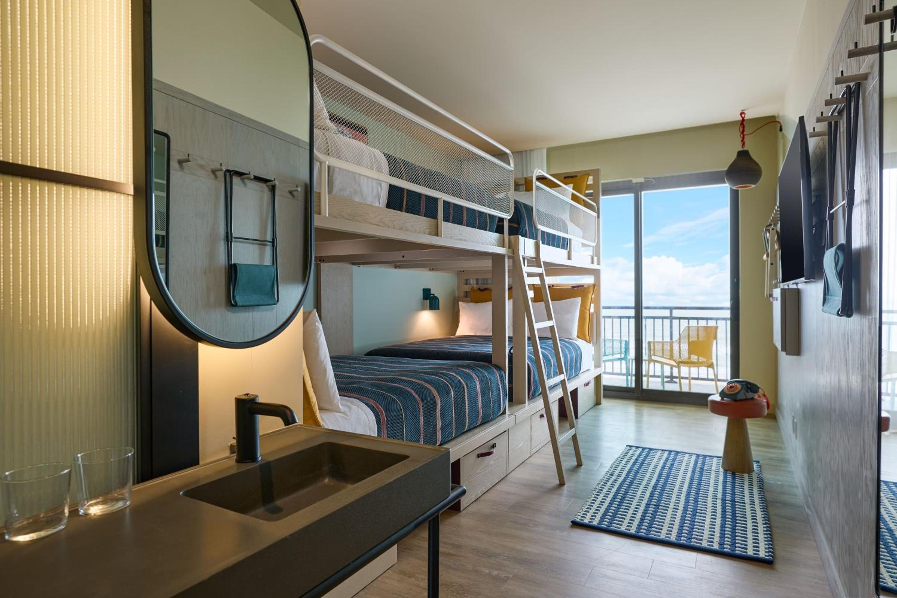 Moxy Quad Room with Four Queen Bunk Beds and Balcony photo 3