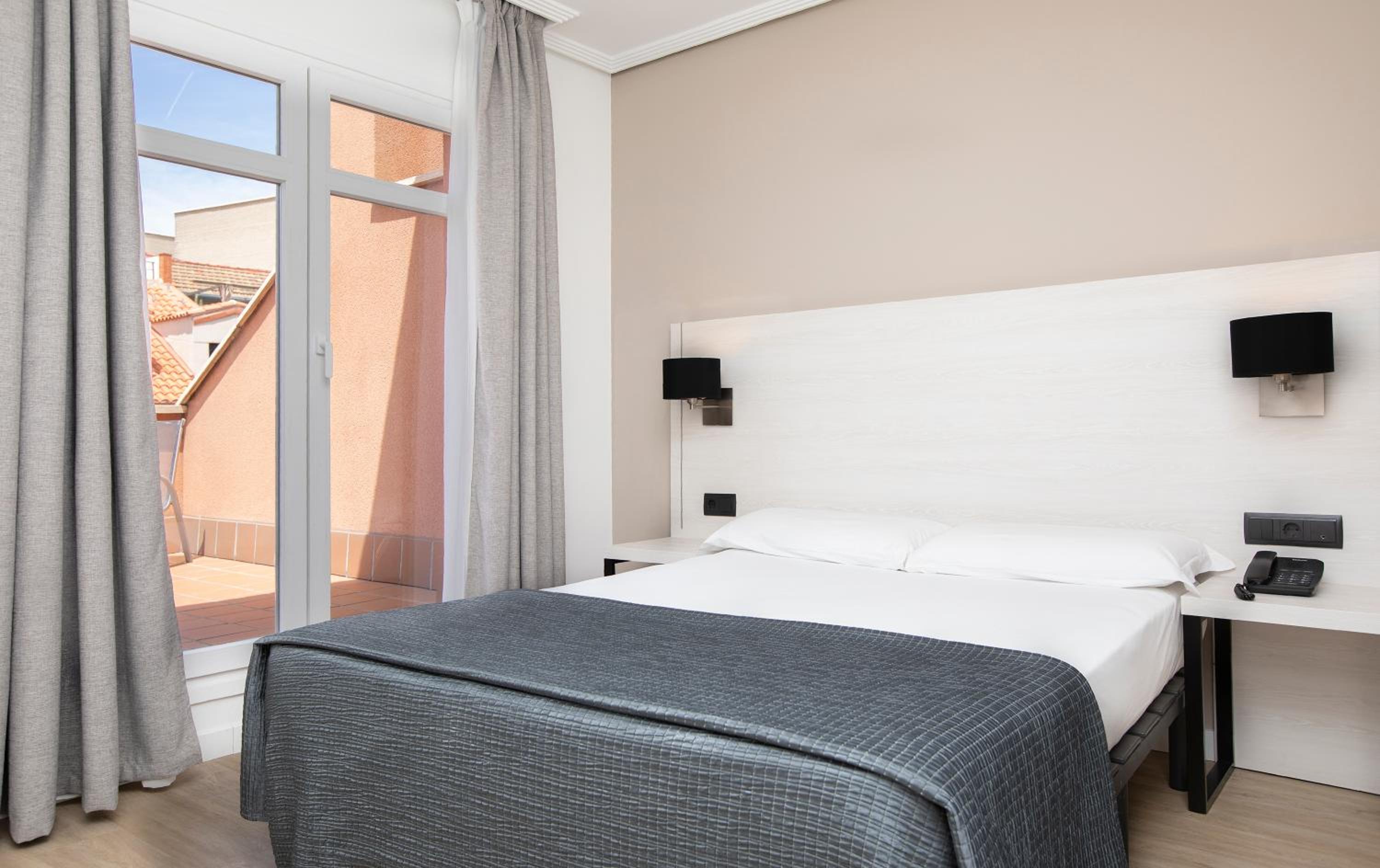 Relax in this cozy and modern hotel room.