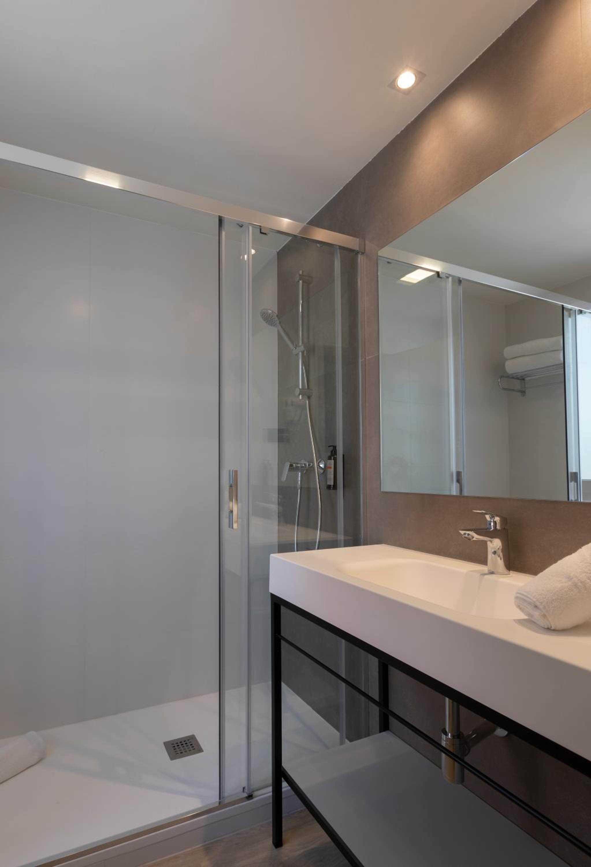 Revitalize in our sleek, modern bathroom oasis!