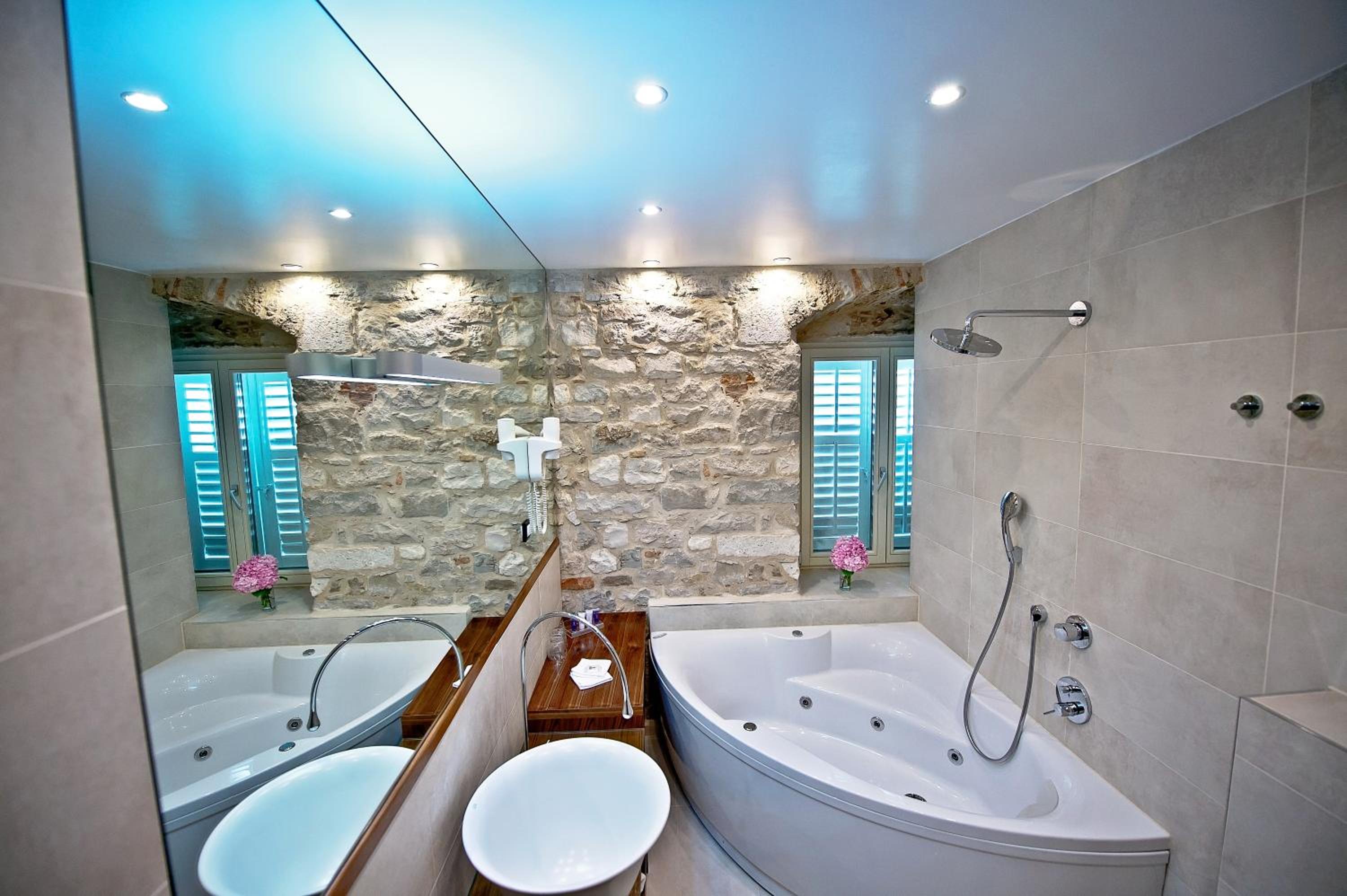 Deluxe Quadruple Room - Photo 16