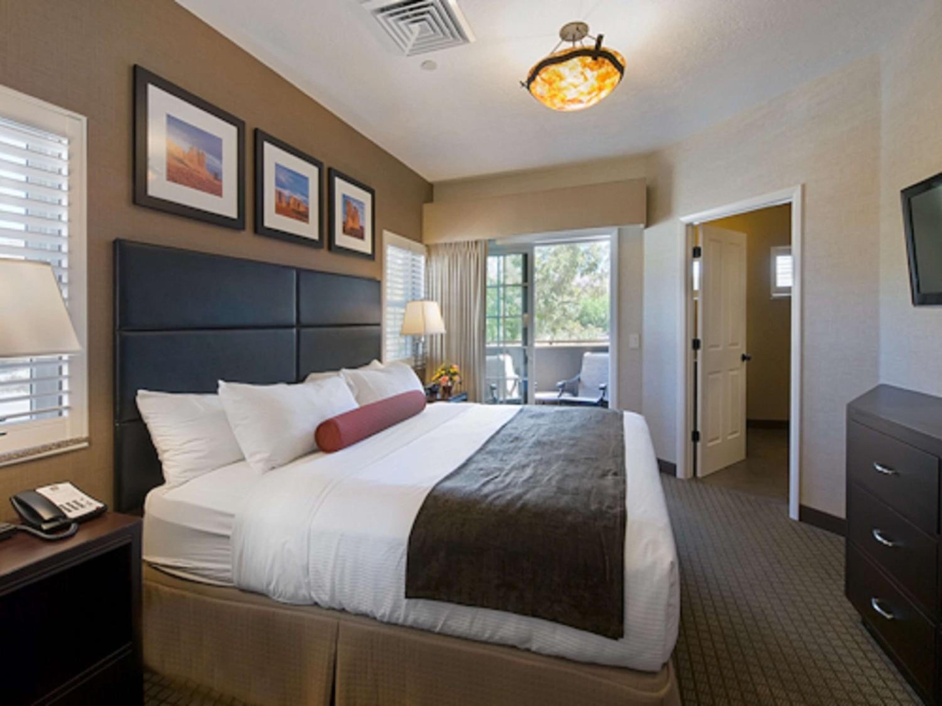 Suite with One King Bed, Two Queen Beds and Balcony - Street View/Stair Access Only/Non-Smoking