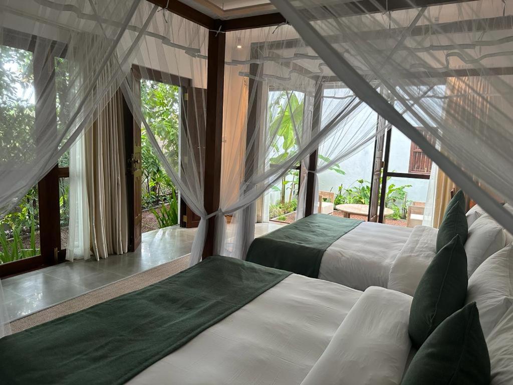 Superior Queen Room with Two Queen Beds - Photo 1