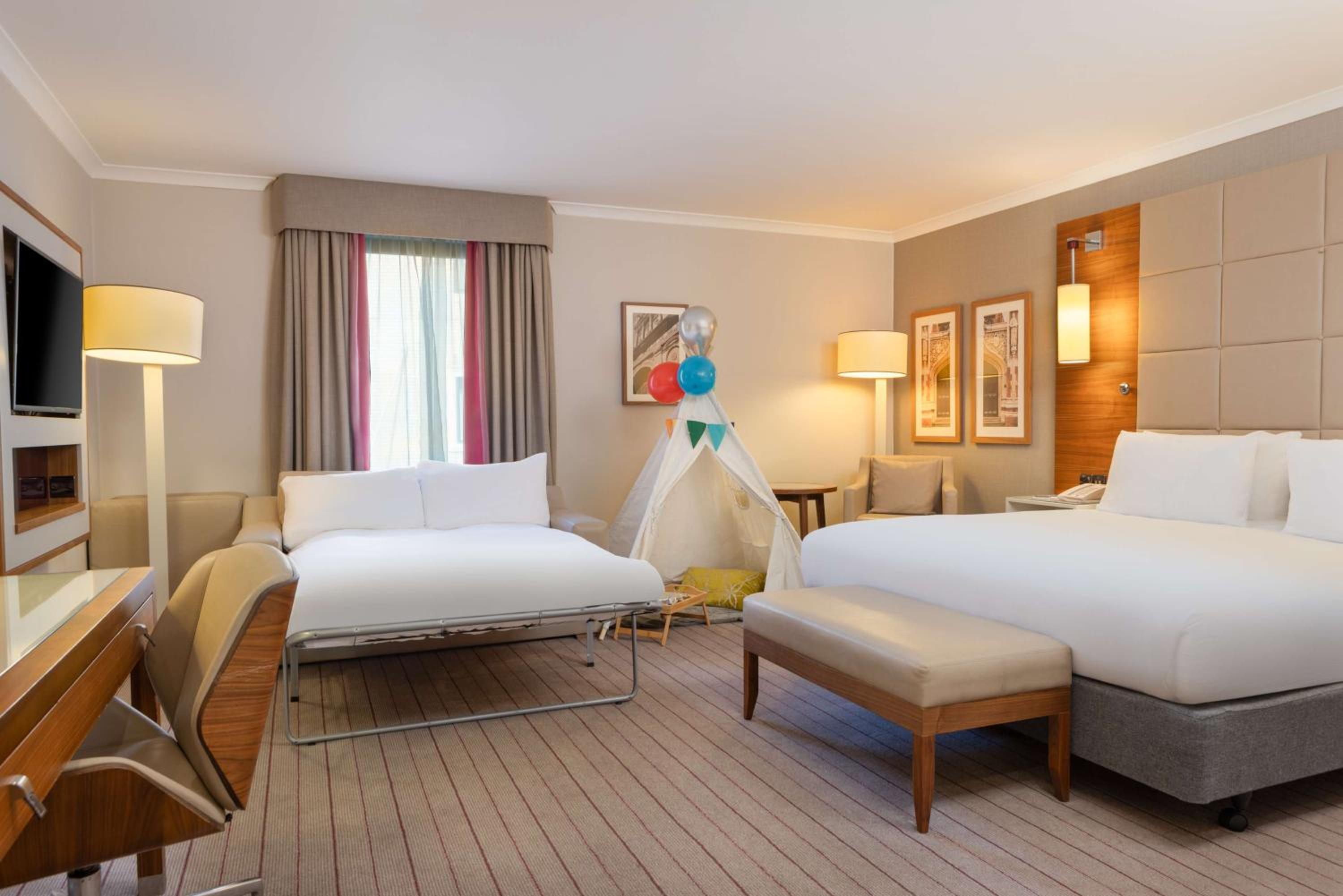 Deluxe King Room with Sofa Bed - Photo 12