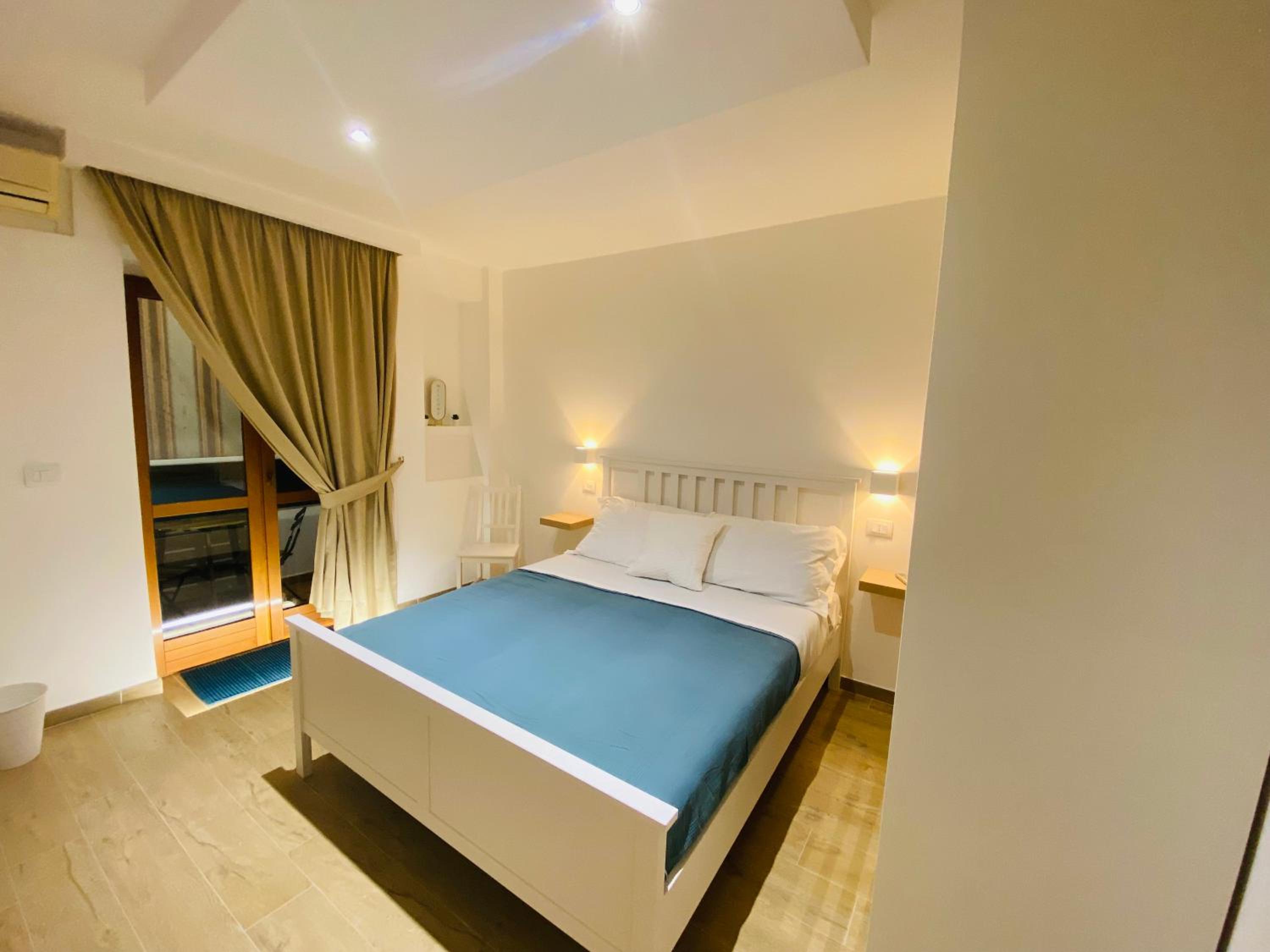 Deluxe Quadruple Room - Photo 6